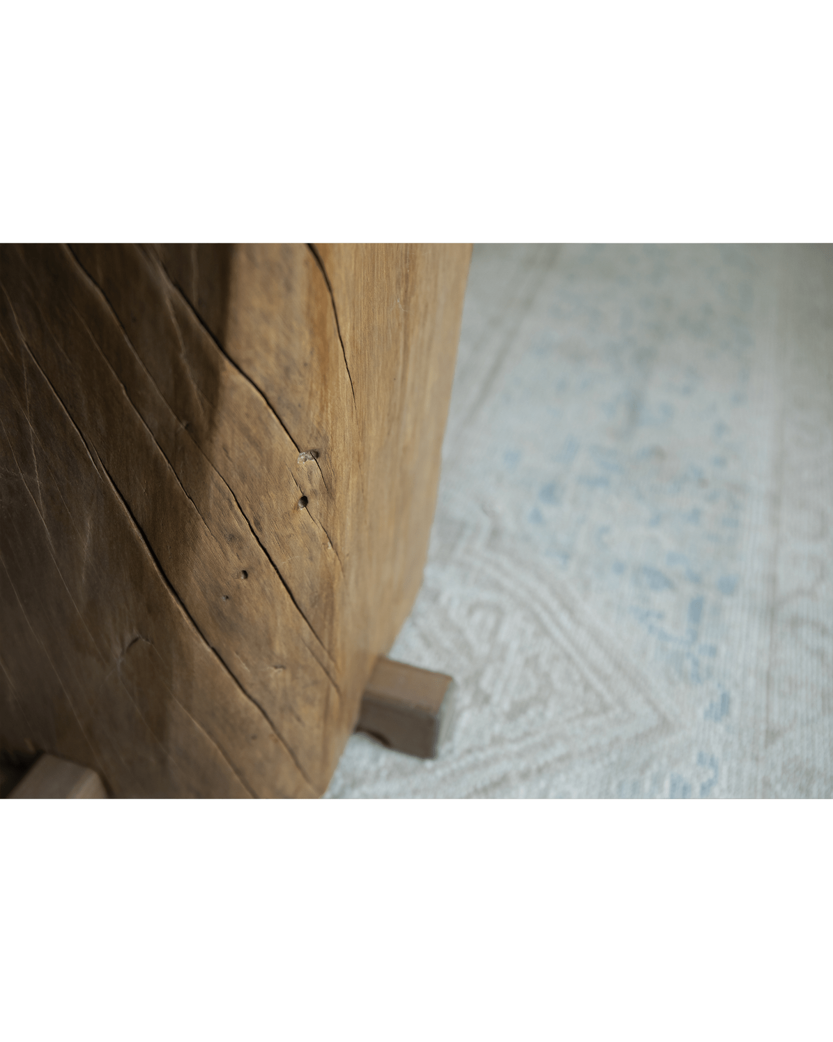 Rustic wooden pedestal detail, showcasing natural wood grain and aged texture, organic interior design
