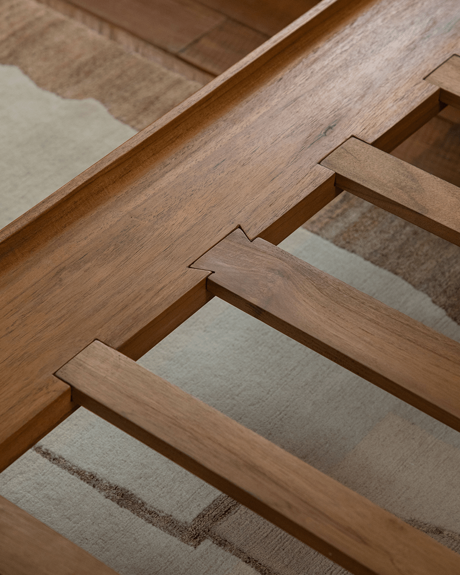 Seren Teak Linen Bed: Solid teak wood bed frame detail, showcasing craftsmanship and natural wood grain.