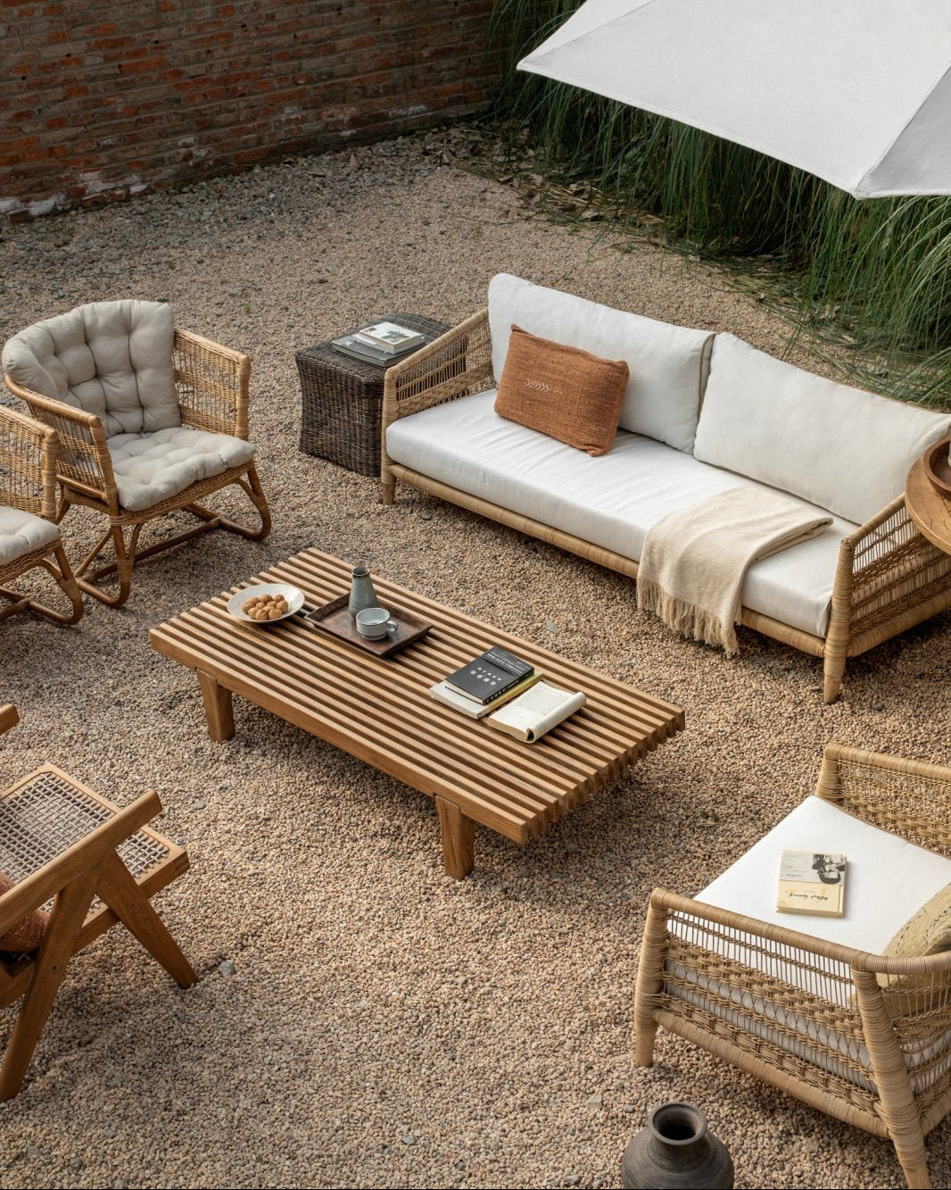 ZM Daybed Coffee Table in outdoor setting with rattan furniture and teak wood table