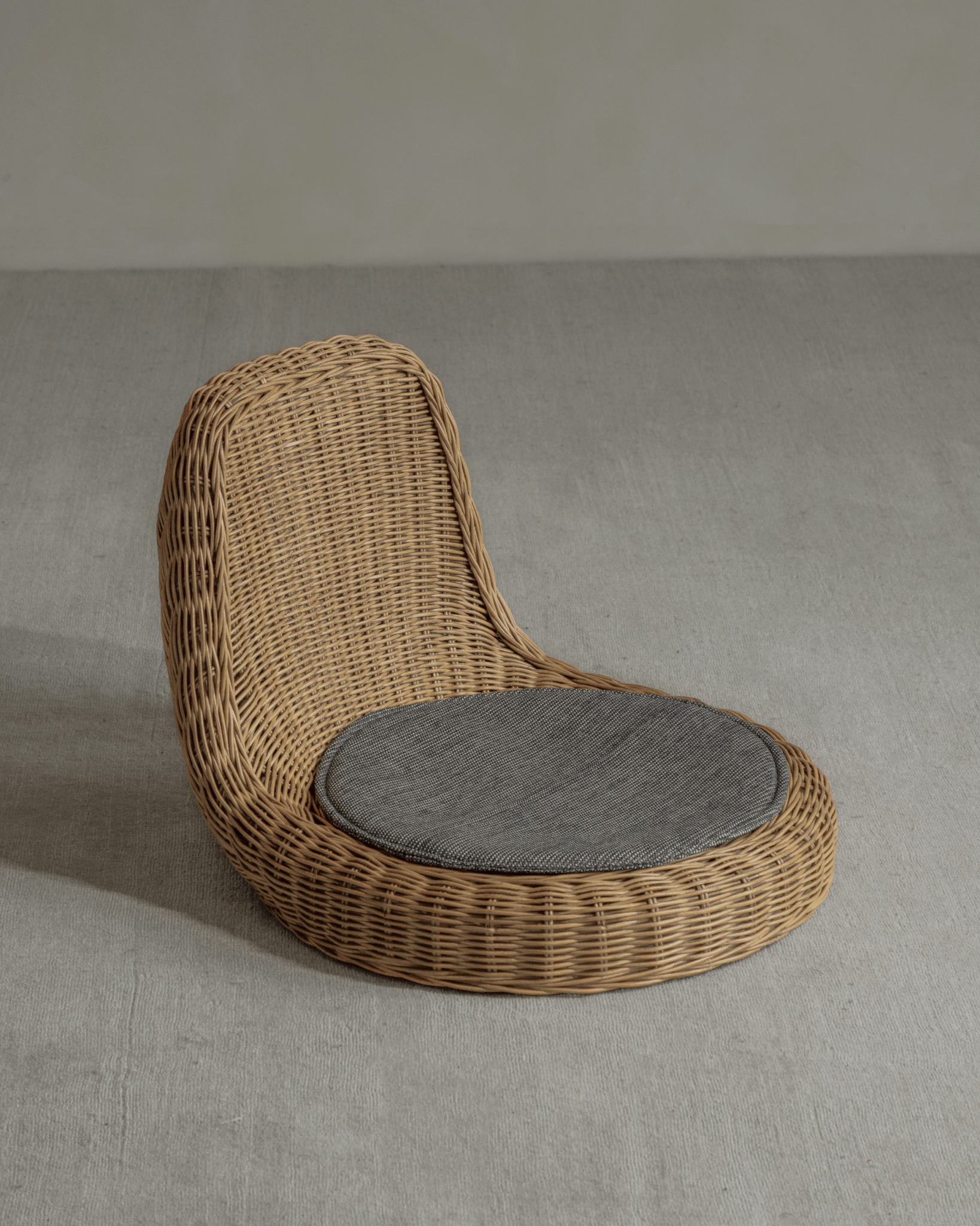 Lotus Tatami Set - Handwoven rattan chair with gray cushion. Perfect for tea room or living space.