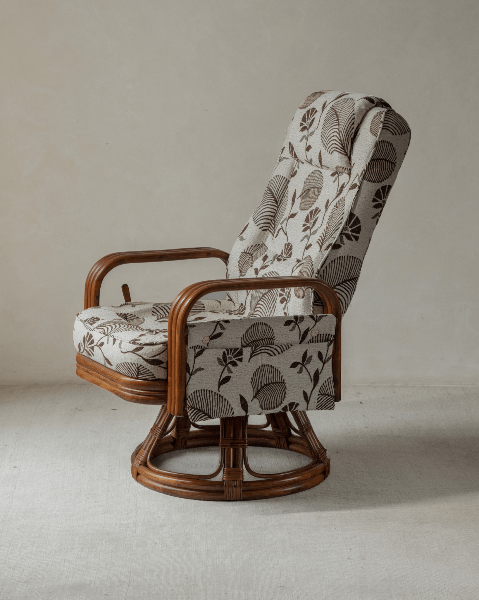 Willow Rattan Chair with natural rattan frame and leaf pattern fabric