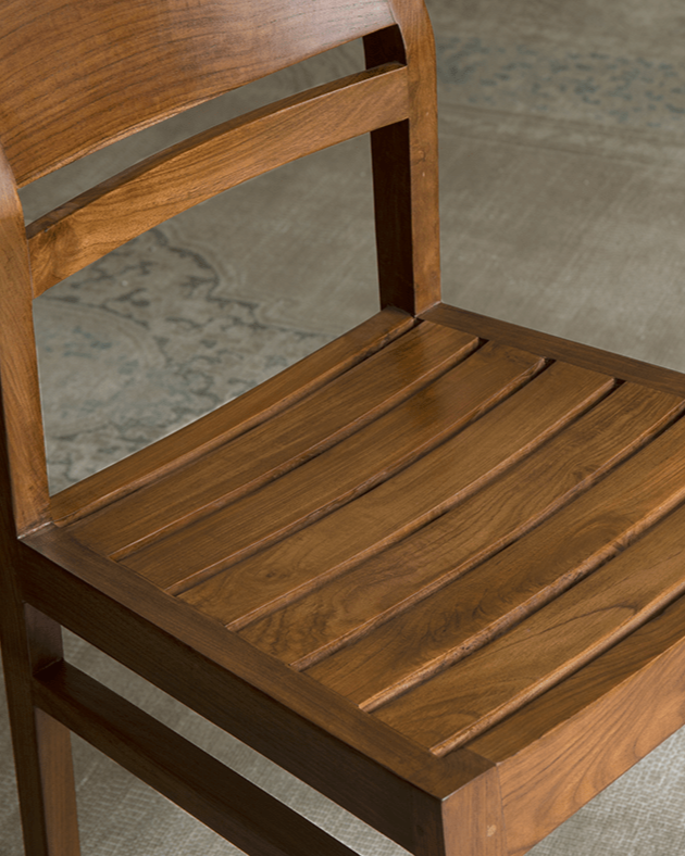 Beam Chair - Teak wood chair with slatted seat, showcasing design and natural warmth.