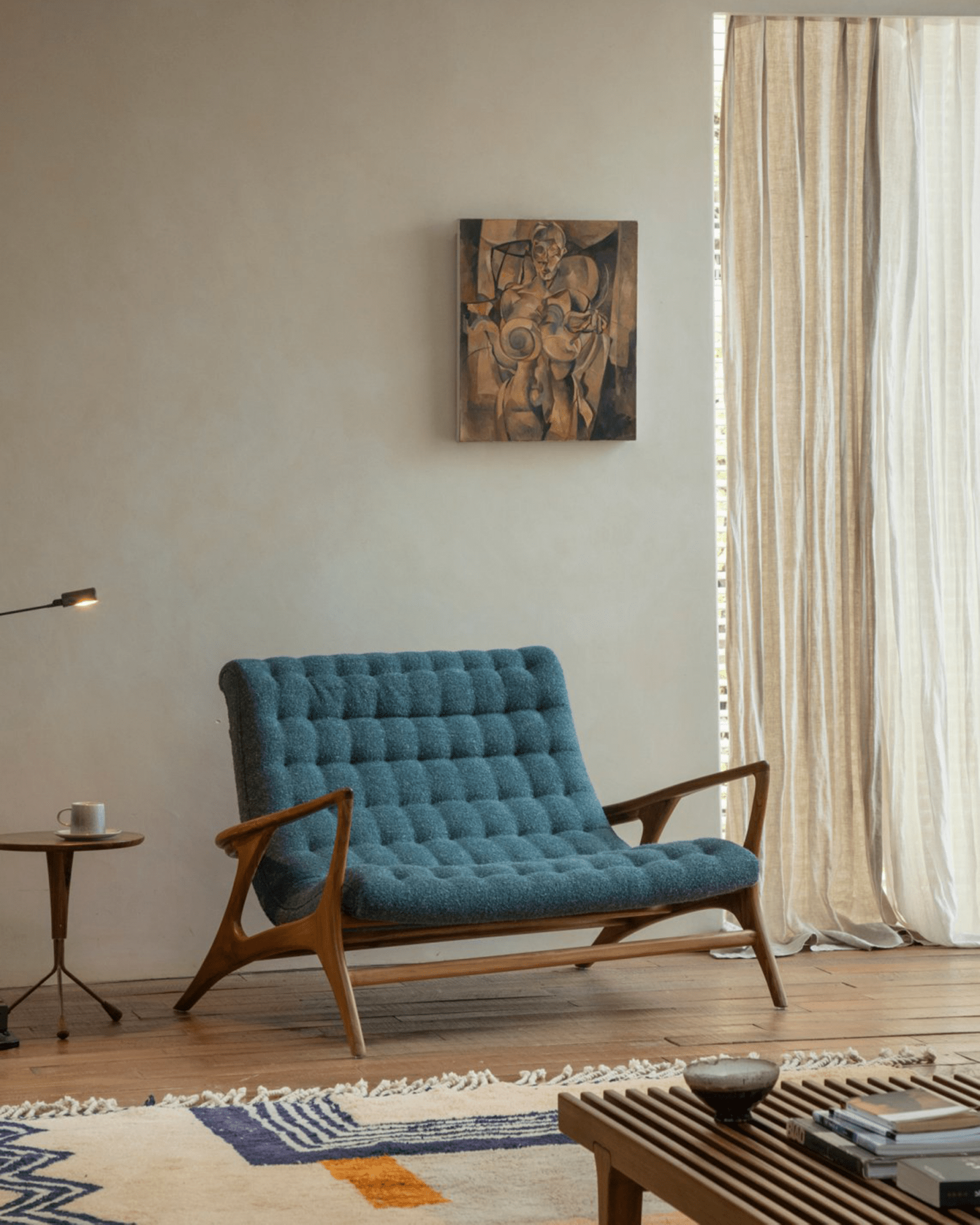 Kagan Lounge Chair in teal bouclé upholstery with teak wood frame, mid-century modern design