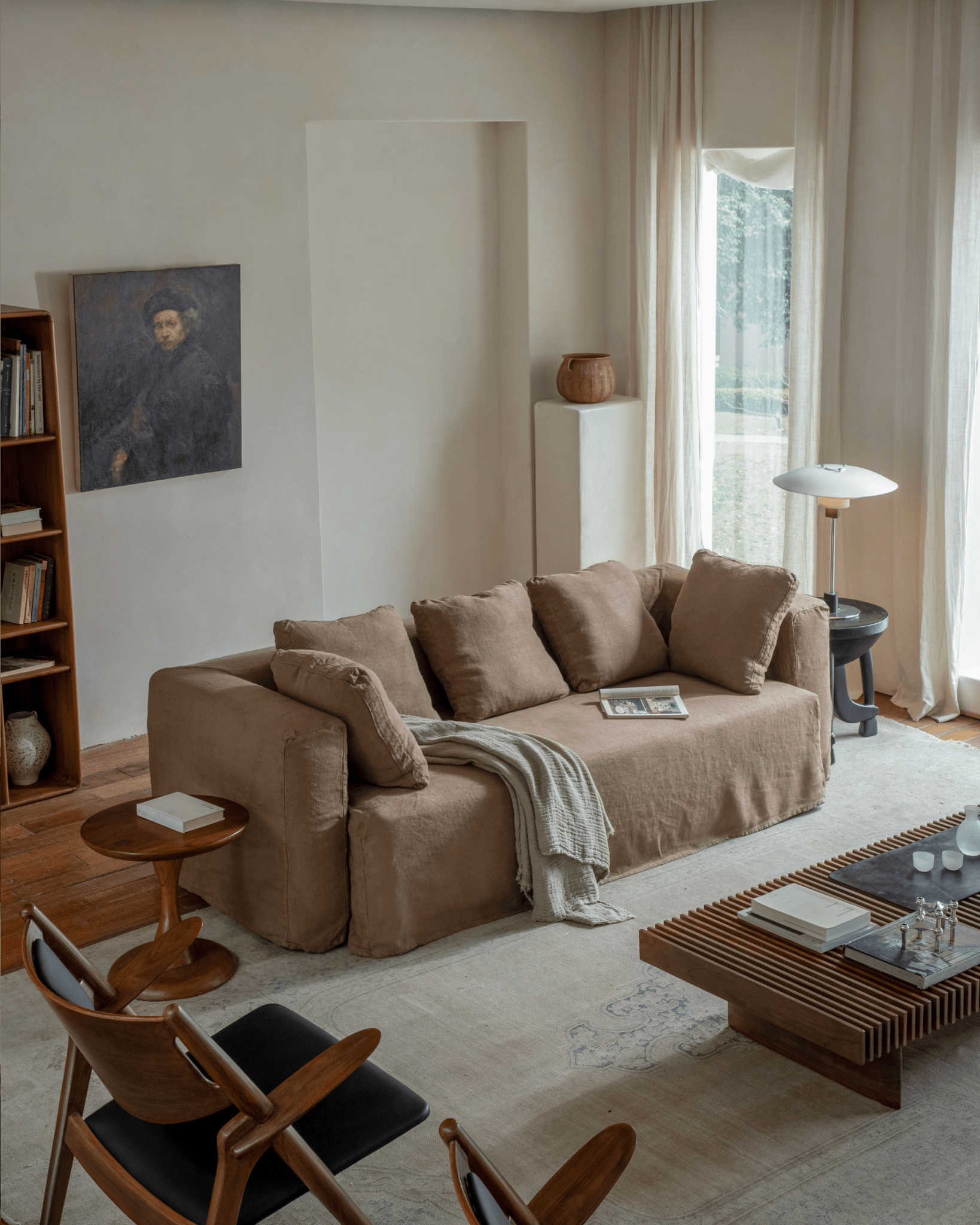 Nola Sofa in natural linen, showcasing a comfortable design in a stylish living room setup