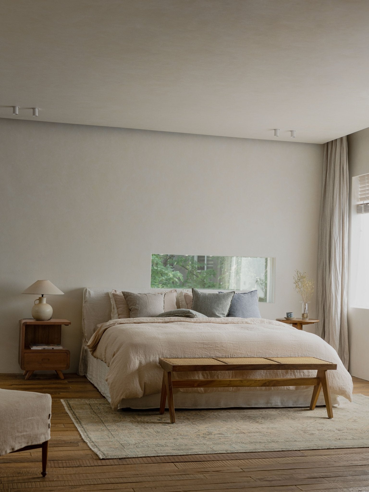 Freya Linen Bed in a neutral bedroom setting with natural linen bedding and wooden furniture for peaceful sleep