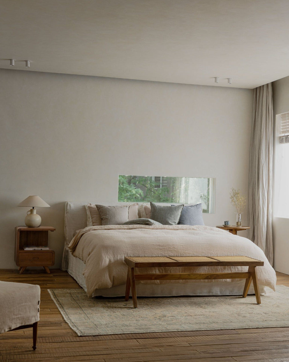 Freya Linen Bed in a neutral bedroom setting with natural linen bedding and wooden furniture for peaceful sleep