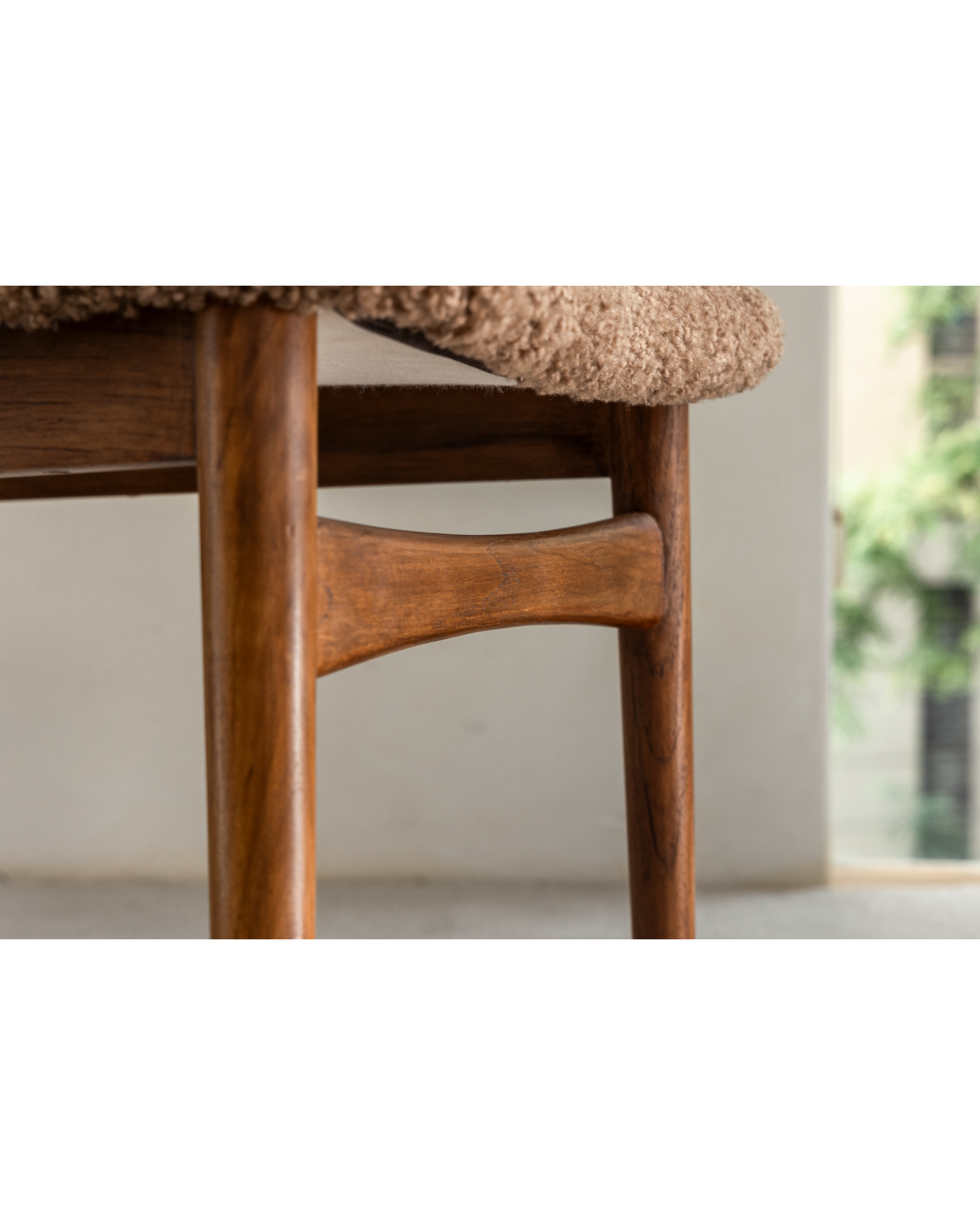 Maren Chair: Teak wood frame joinery and soft beige lambswool seat detail.