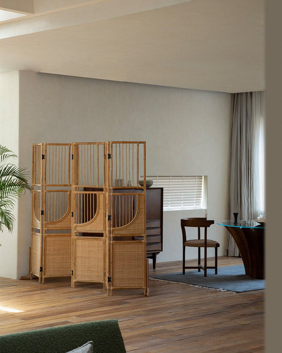 Sunlit four-panel Indonesian rattan screen room divider, minimalist interior design