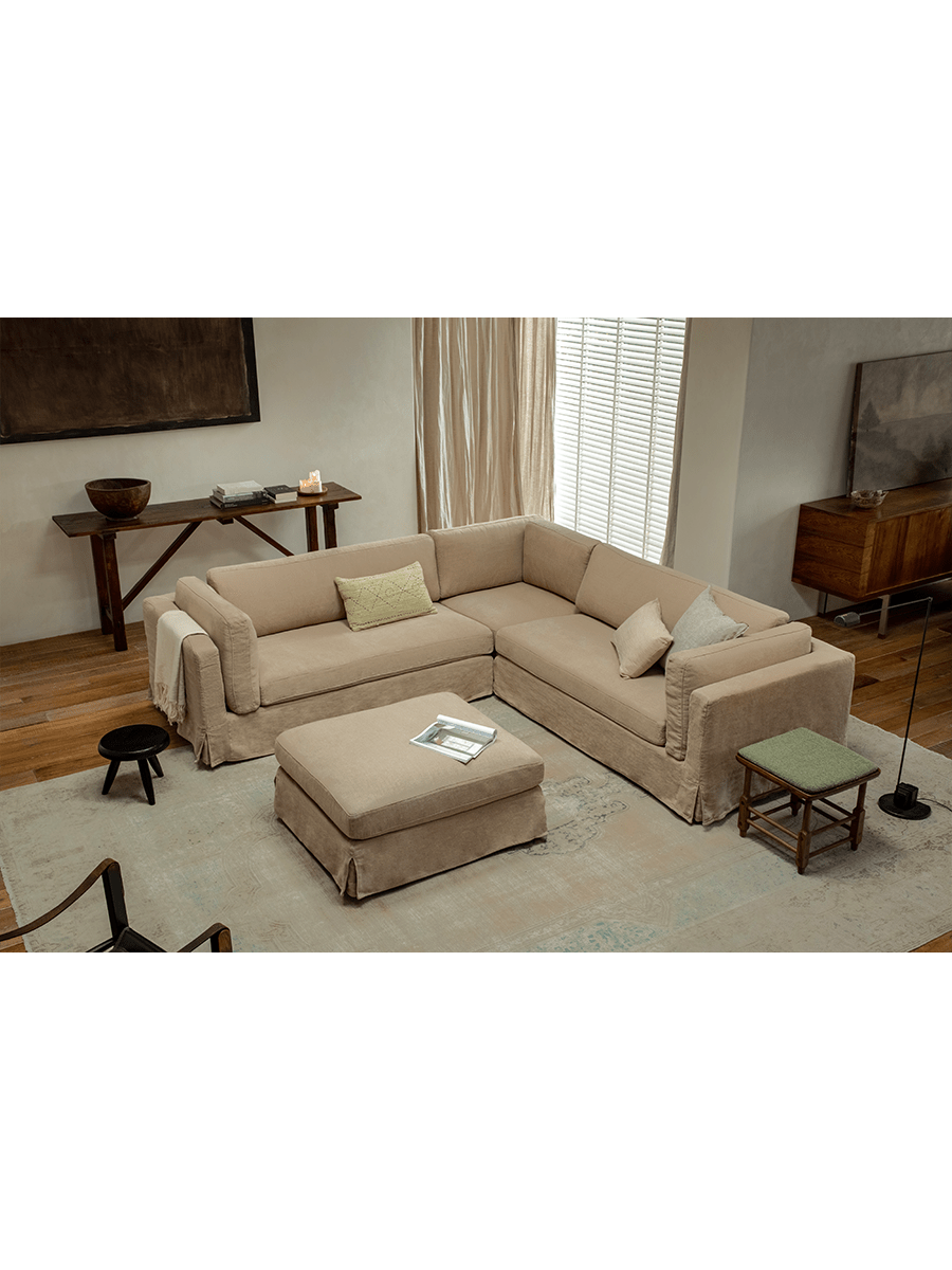 Beige linen Skirt Sectional Sofa in modern living room with modular design and ottoman for customizable comfort