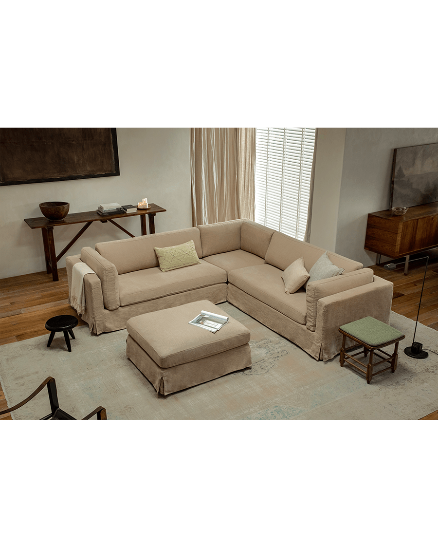 Beige linen Skirt Sectional Sofa in modern living room with modular design and ottoman for customizable comfort