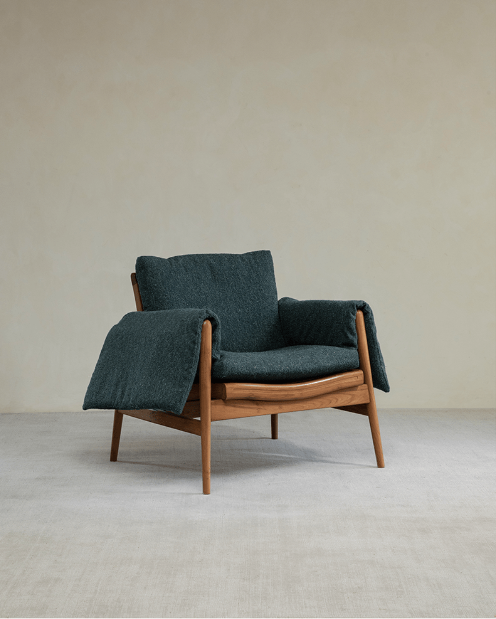 Teak wood garden lounge chair with teal cushion and blanket, modern design, indoor or outdoor use