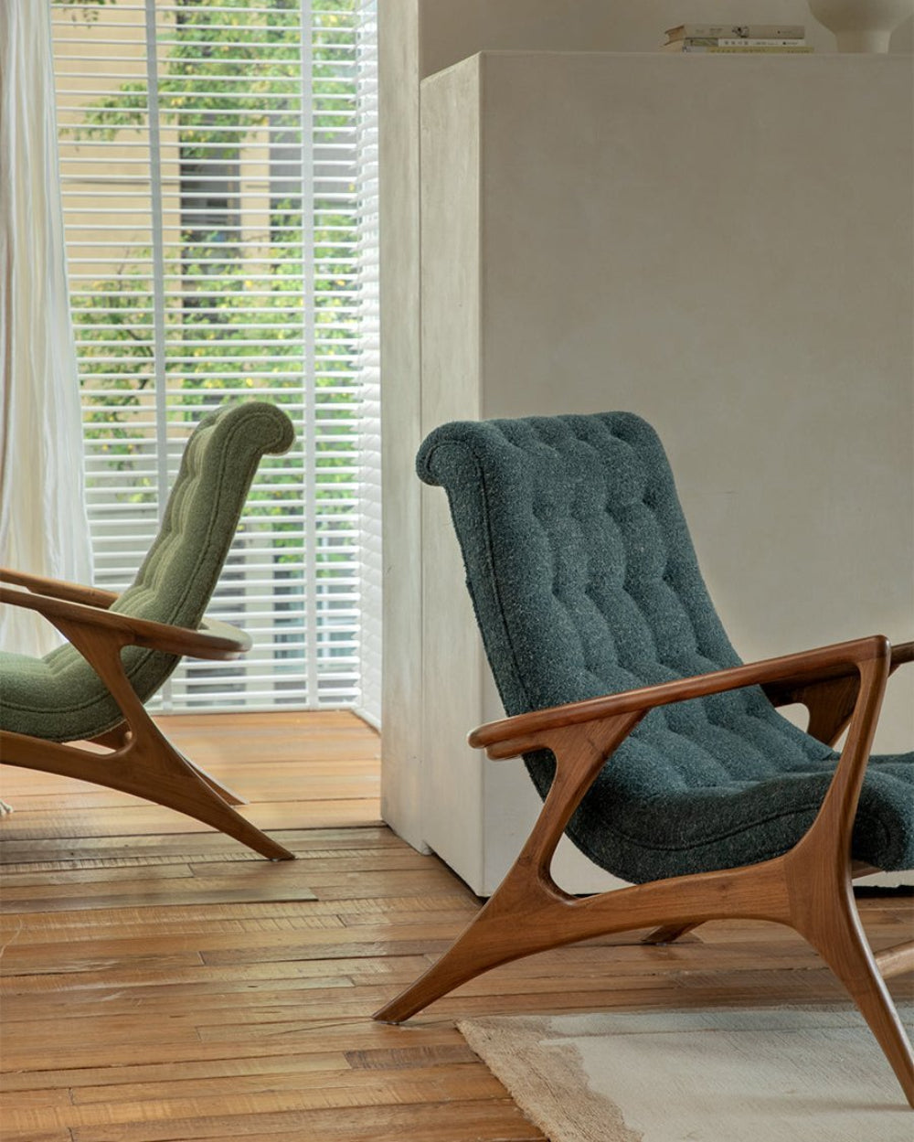 Teal bouclé Kagan Lounge Chair with solid teak wood frame and ergonomic design, Mid-century modern style