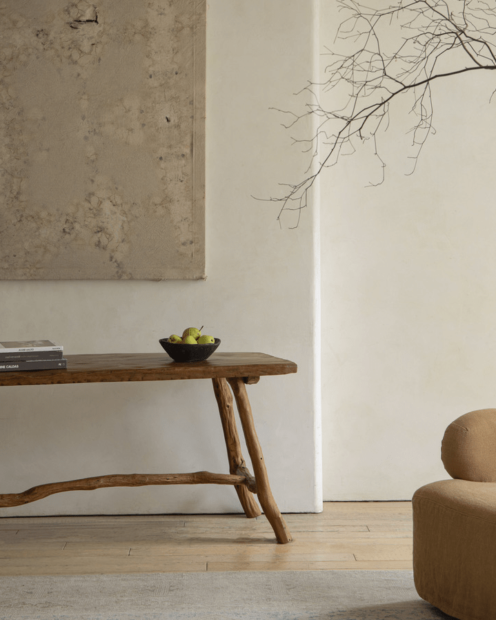 Branch Console Table in rustic interior, natural wood grain, organic design with fruit and decor