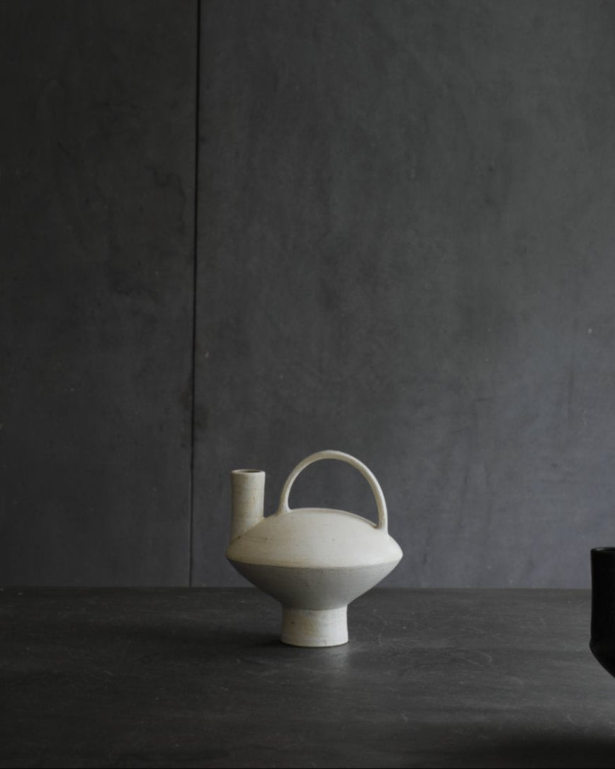 White ceramic vase with handle, modern design, home decor, black vase