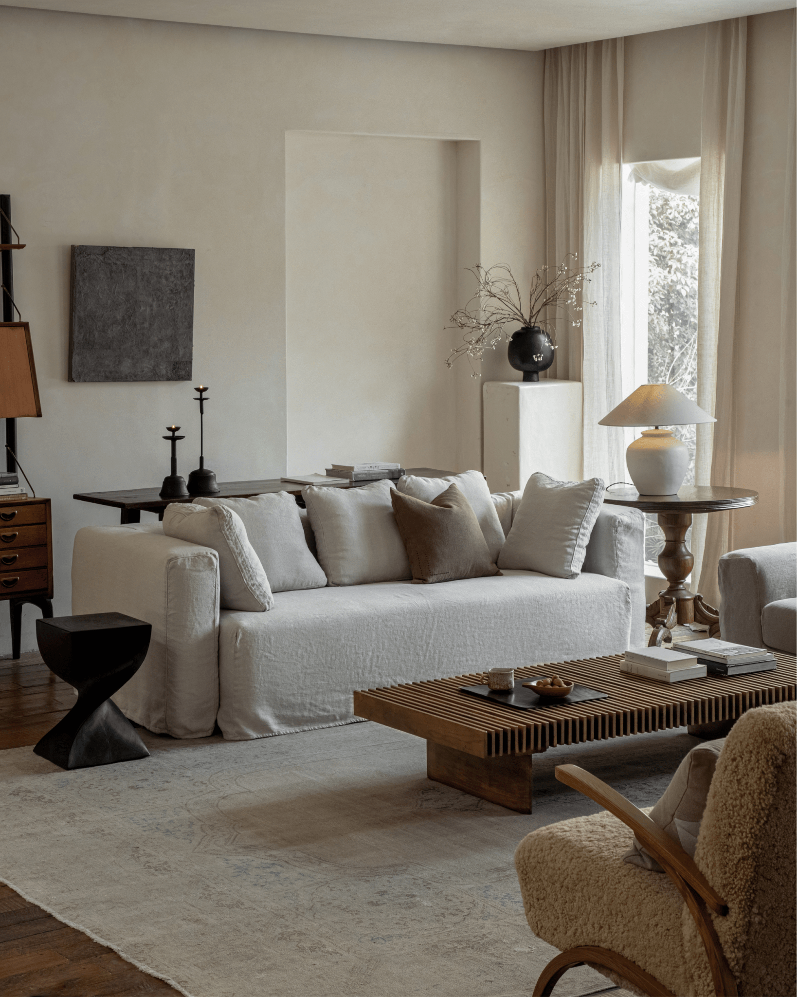 Nola Sofa in natural linen, comfortable linen sofa in a stylish living room, with wooden accents and cozy setting.
