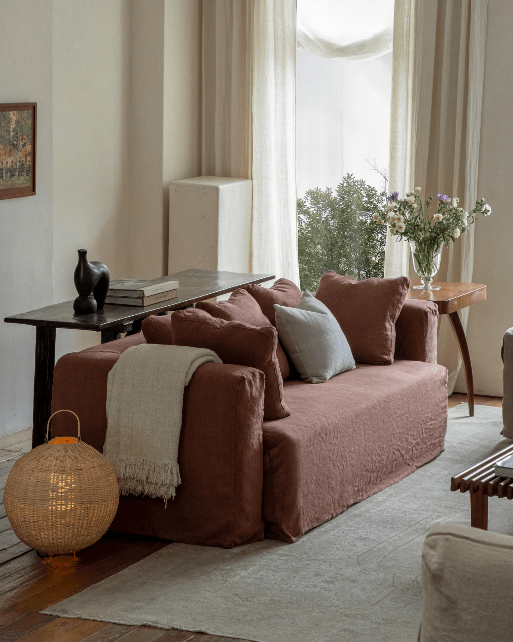 Nola Sofa in Shadow Red linen in a cozy living room setting, showcasing comfortable cushions and design