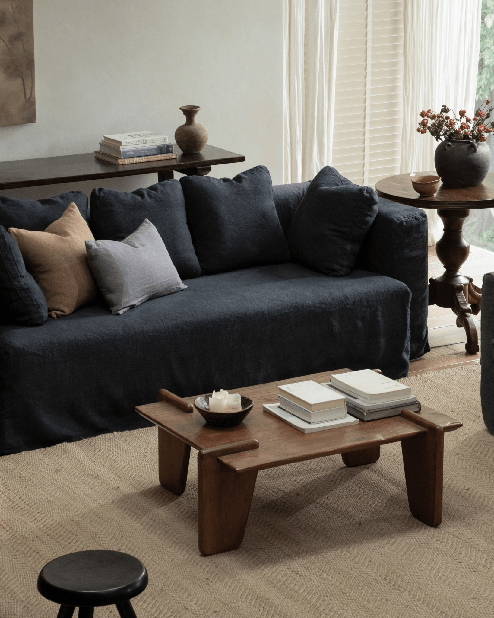 Nola Sofa in Shadow Blue linen, a stylish living room design with comfortable, down-filled cushions and wooden accents
