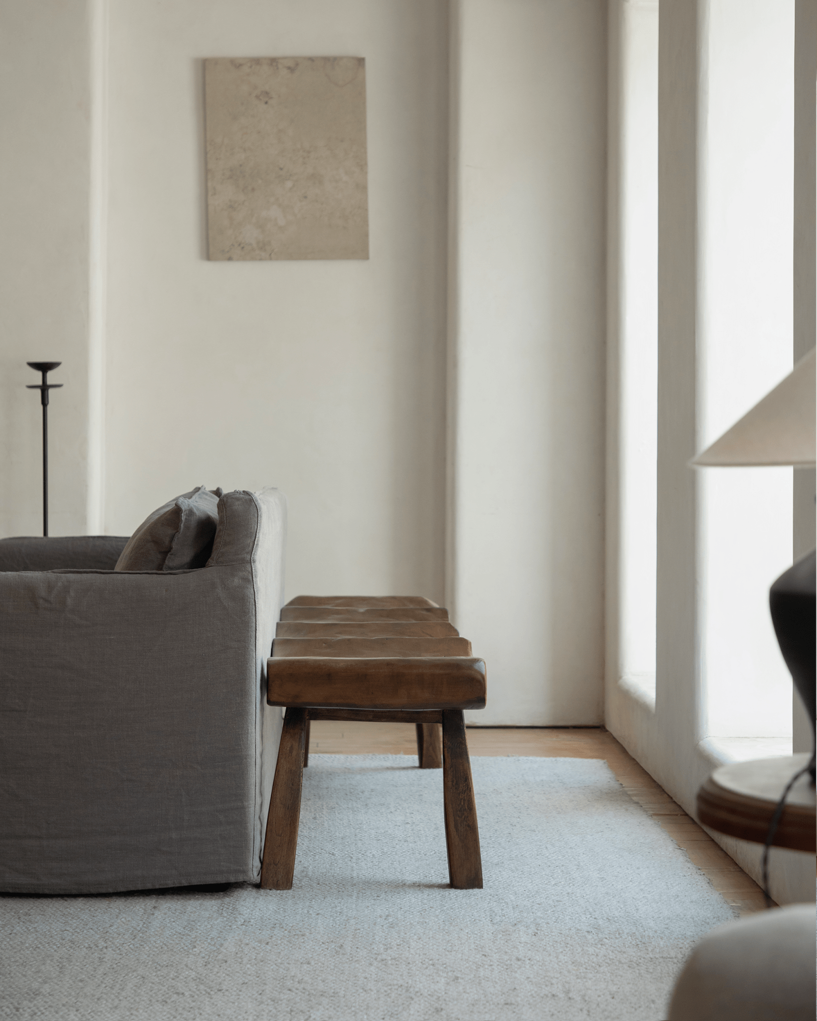 Tildes Bench, solid wood bench with curved seat, brown color, minimalist interior.