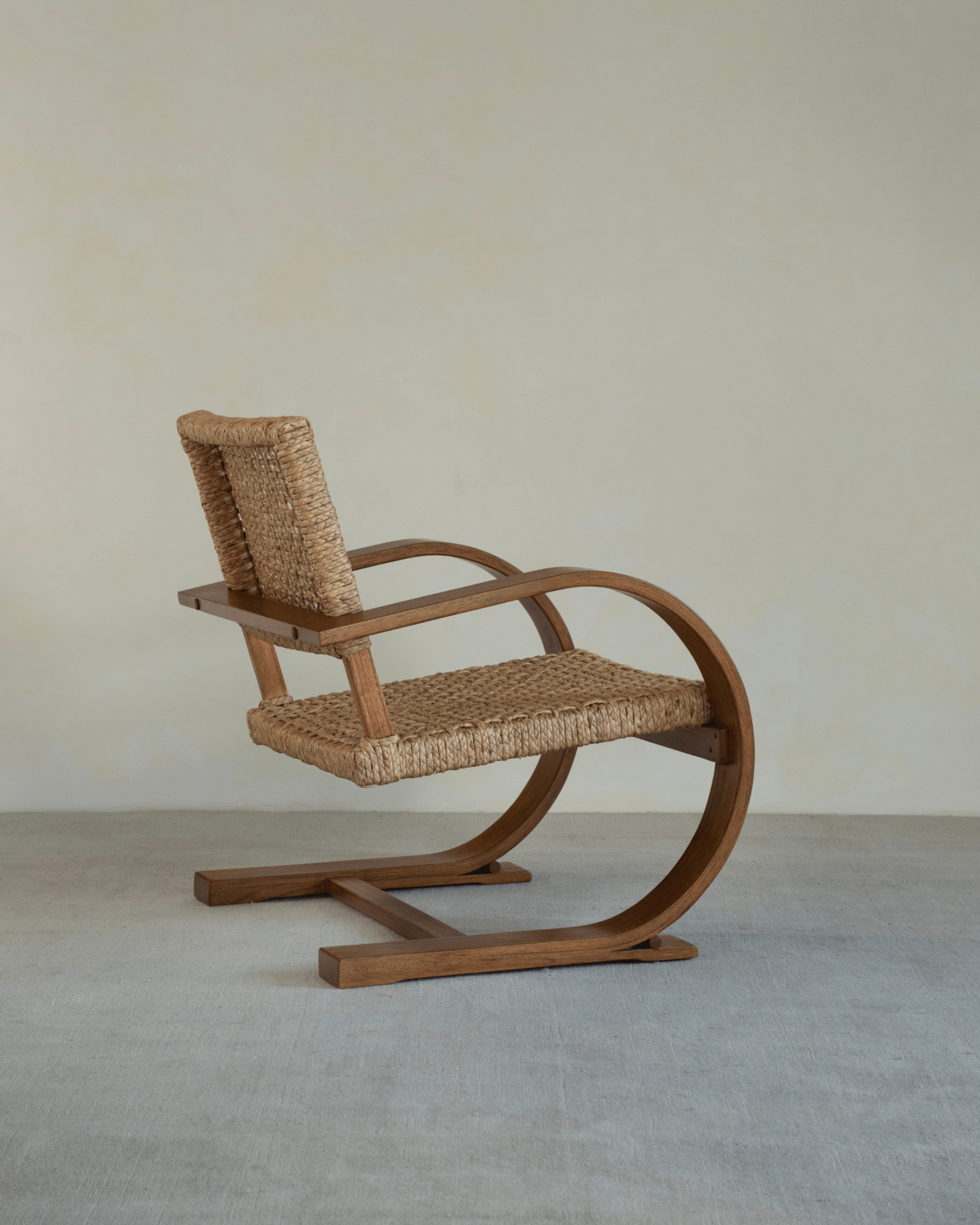C Curve Lounge Chair with bentwood frame and woven grass rope seat. Mid-century modern design.