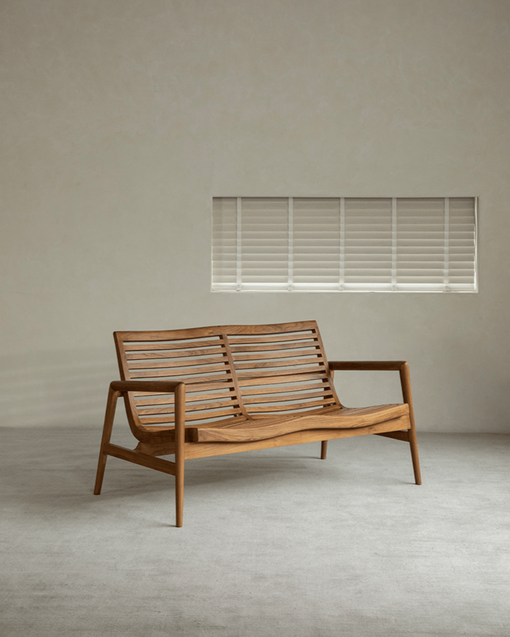 Teak wood garden lounge chair with slatted back and armrests, modern design, indoor comfort