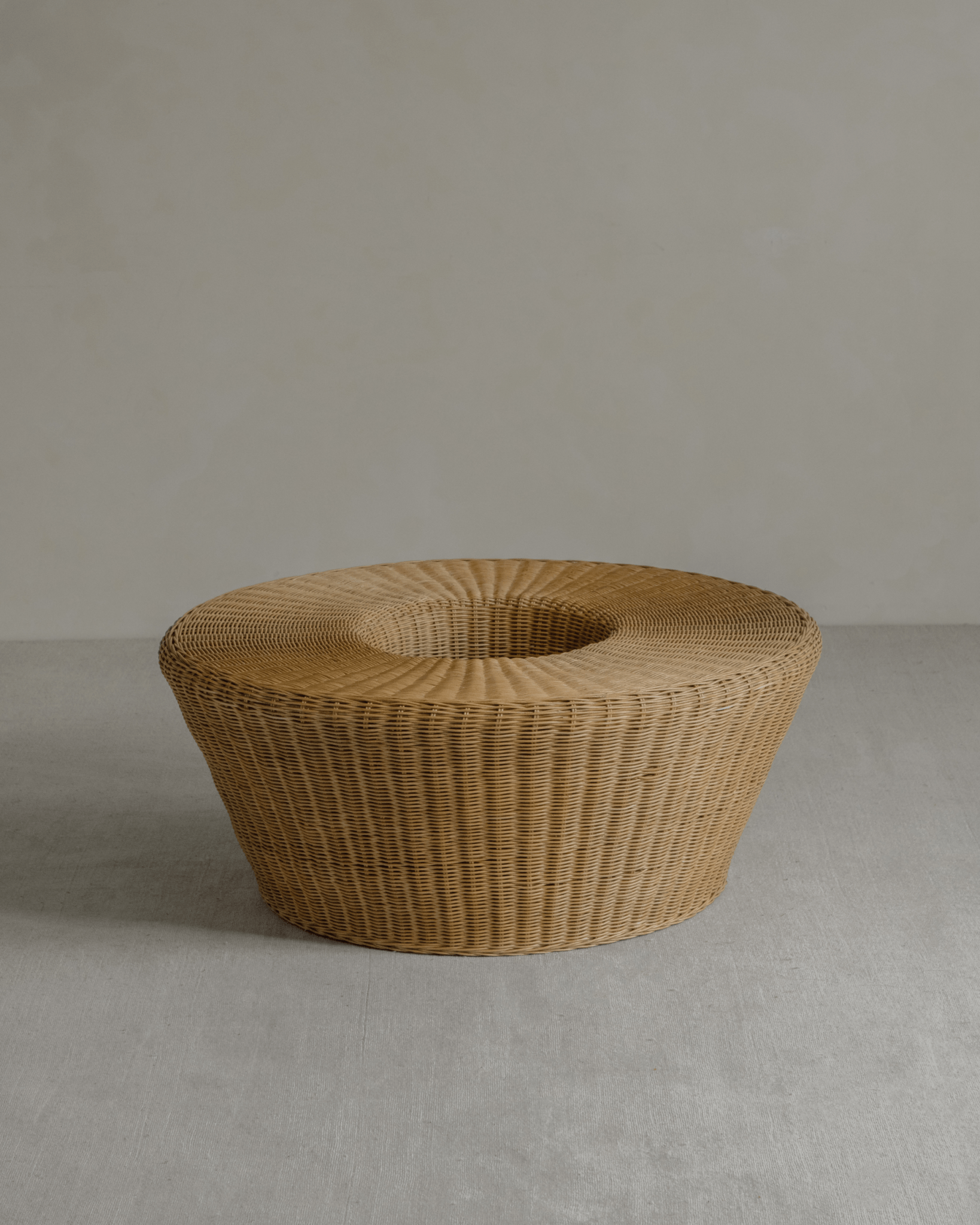 Nest Coffee Table - Round rattan coffee table with sunken design, ideal for living room centerpiece.