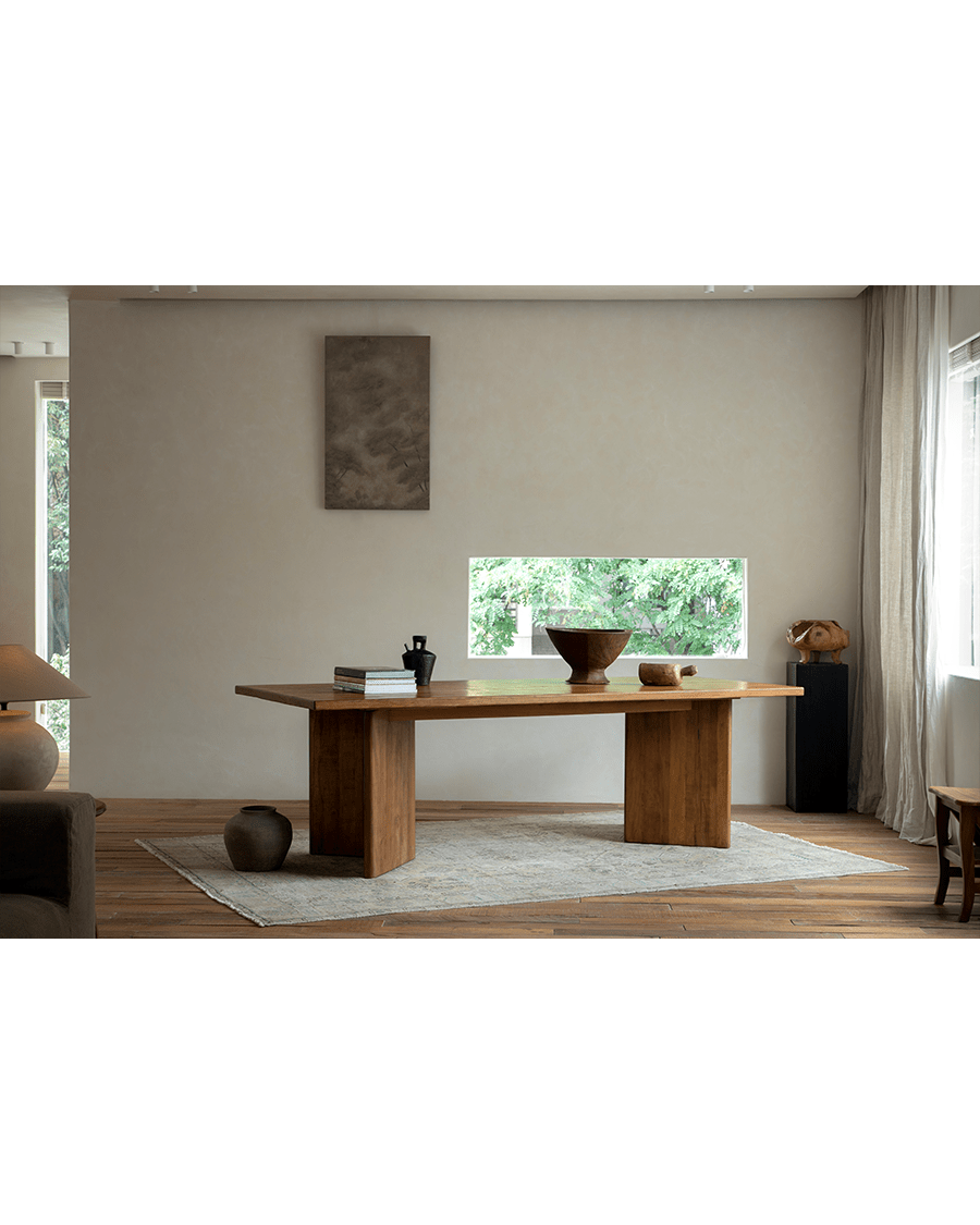 Zephyr Dining Table in natural wood with solid legs, minimalist design, perfect for bright dining rooms