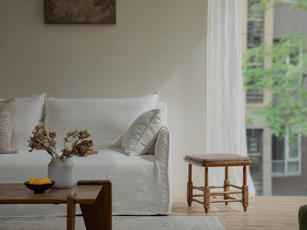 Magrini Stool in zebrawood with a padded cushion, placed in an interior setting.