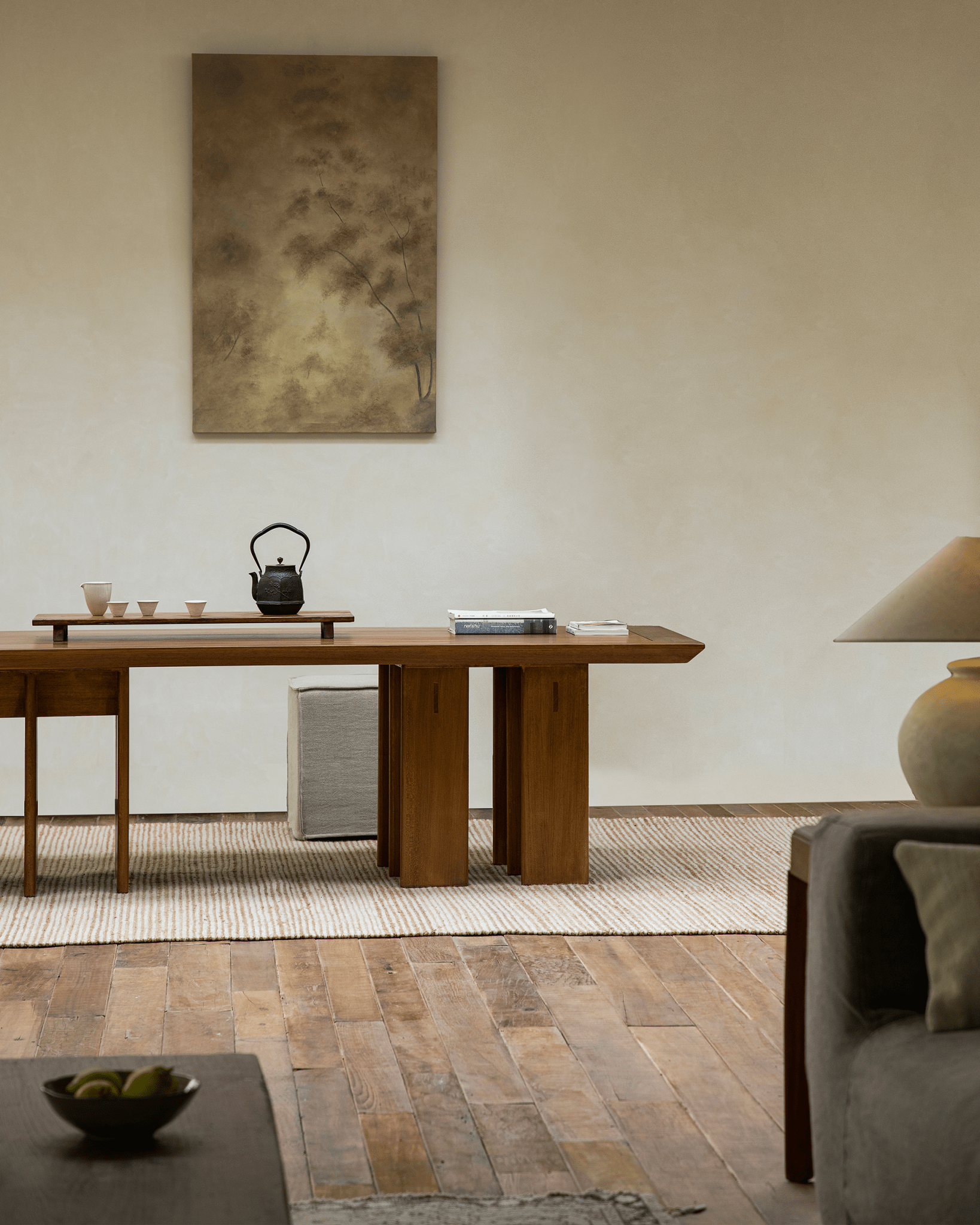 Titan Teak Dining Table in modern room setting, multi-leg design, teak wood, and tea set.