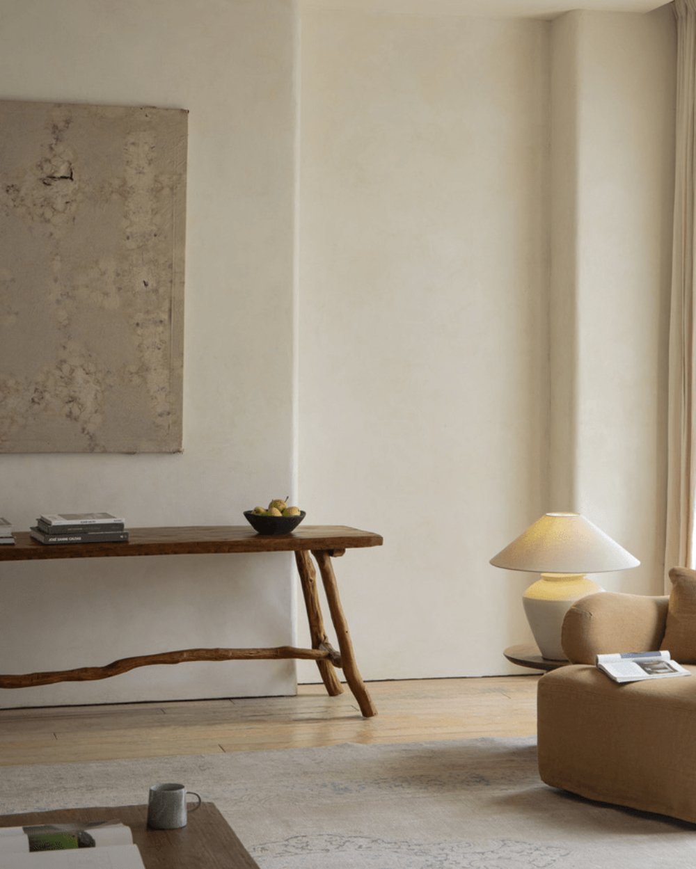 Branch Console Table in rustic setting, natural wood grain, branch legs, and artisanal construction
