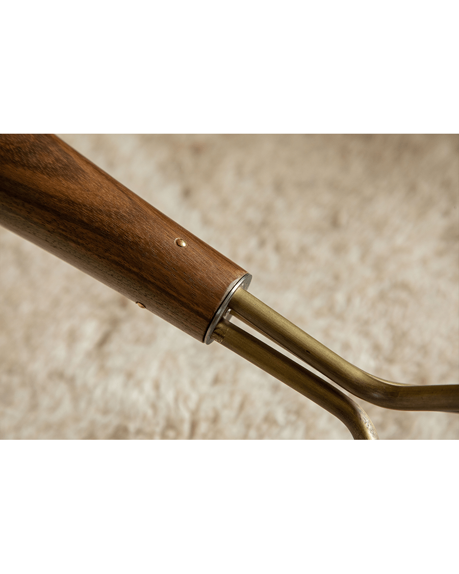 Larsson Side Table detail: Ebony wood and brass tripod base construction.