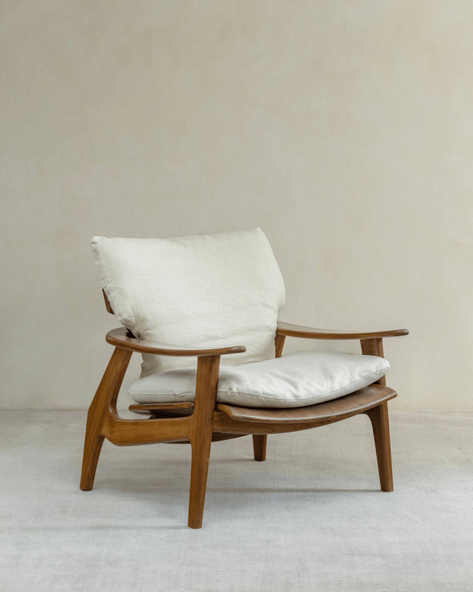 Zen Armchair with light brown wood, white cushions, ergonomic design for relaxation and comfort