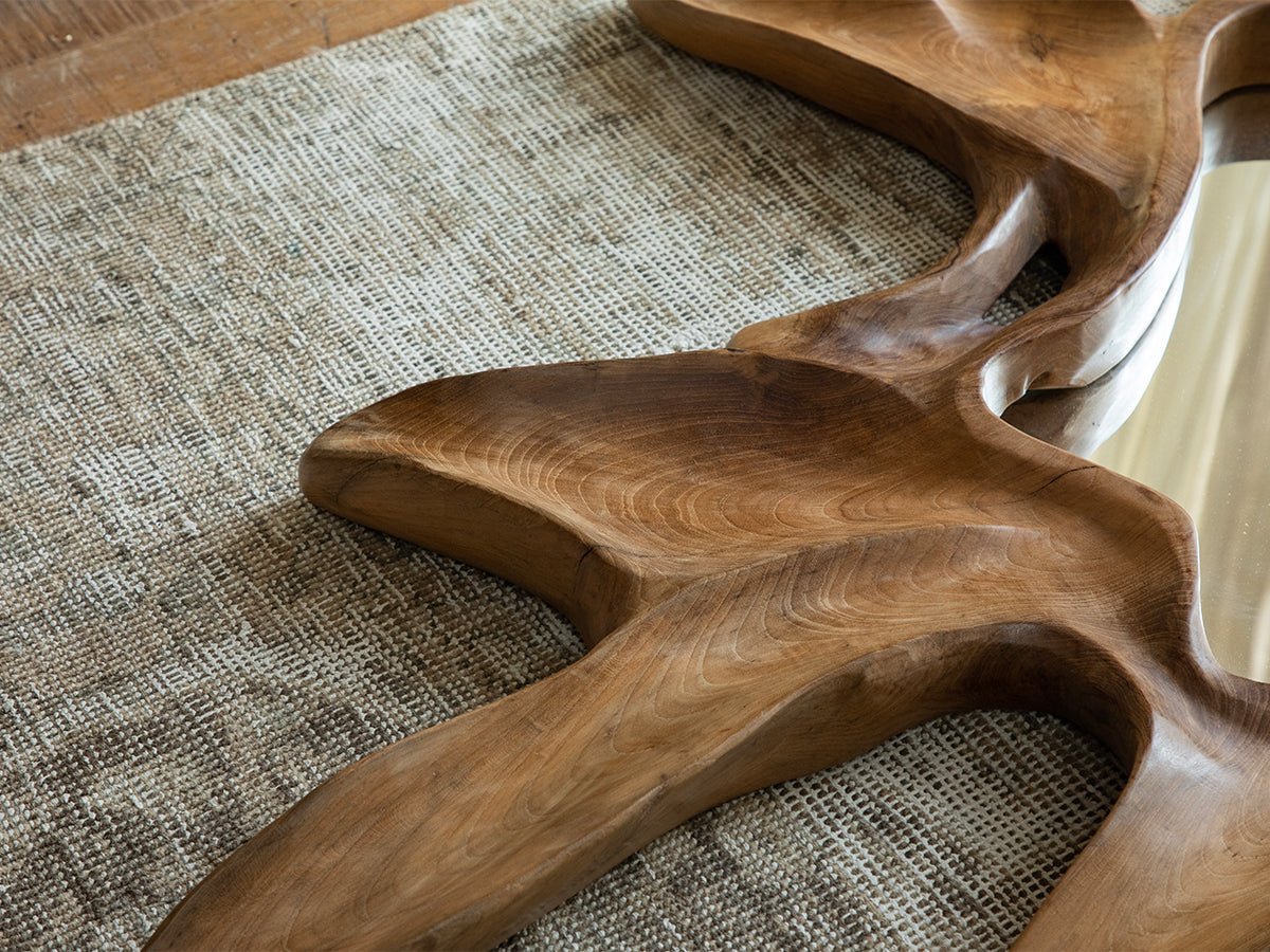 Handcrafted Organic Wood Arbor Mirror with natural shape on a textured rug, modern wall decor