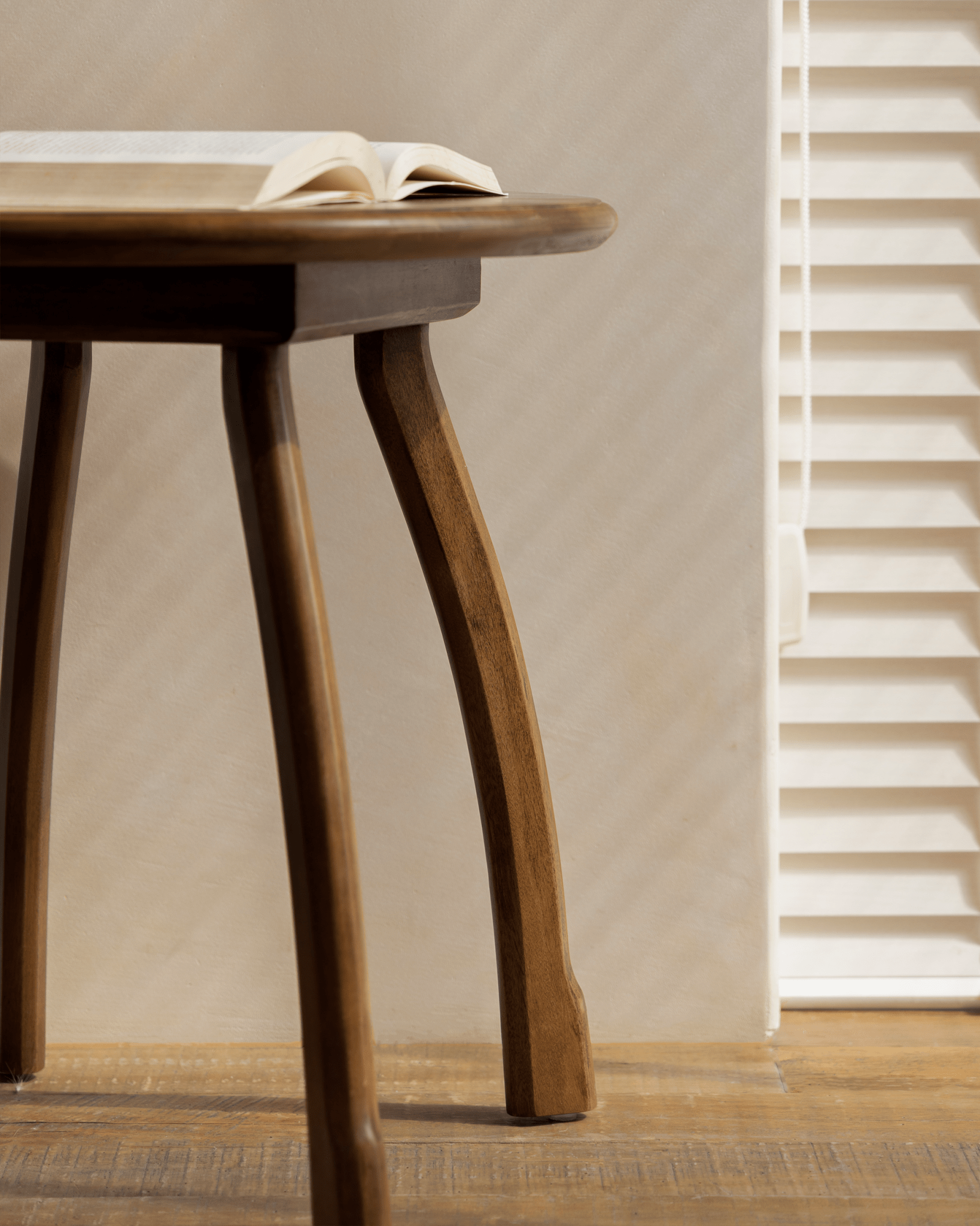 Ele Round Side Table with book, vintage Phoebe wood, octopus legs. Perfect for a cozy living room