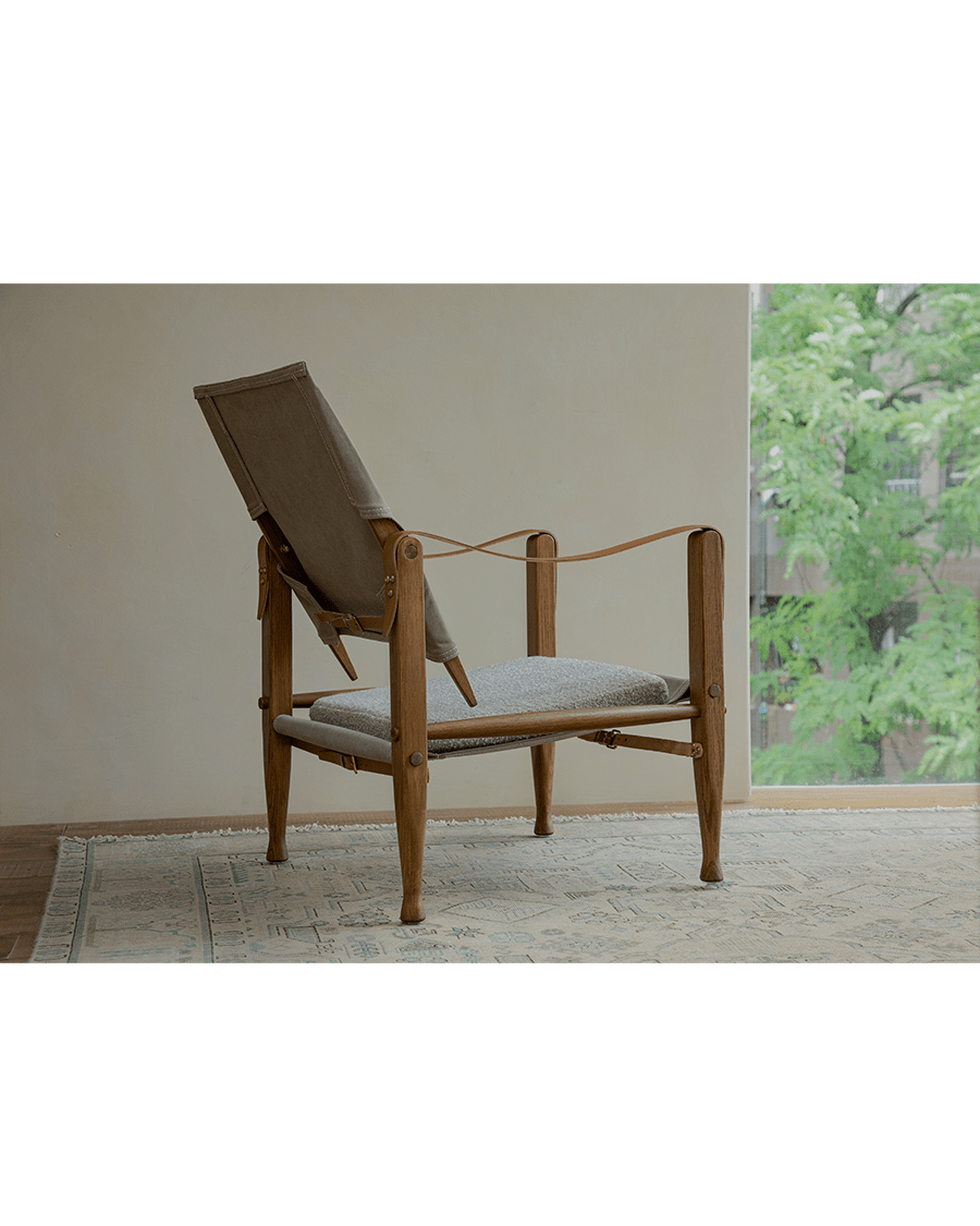 Safari Chair in US Red Oak with canvas backrest and cushion, elegant portable design