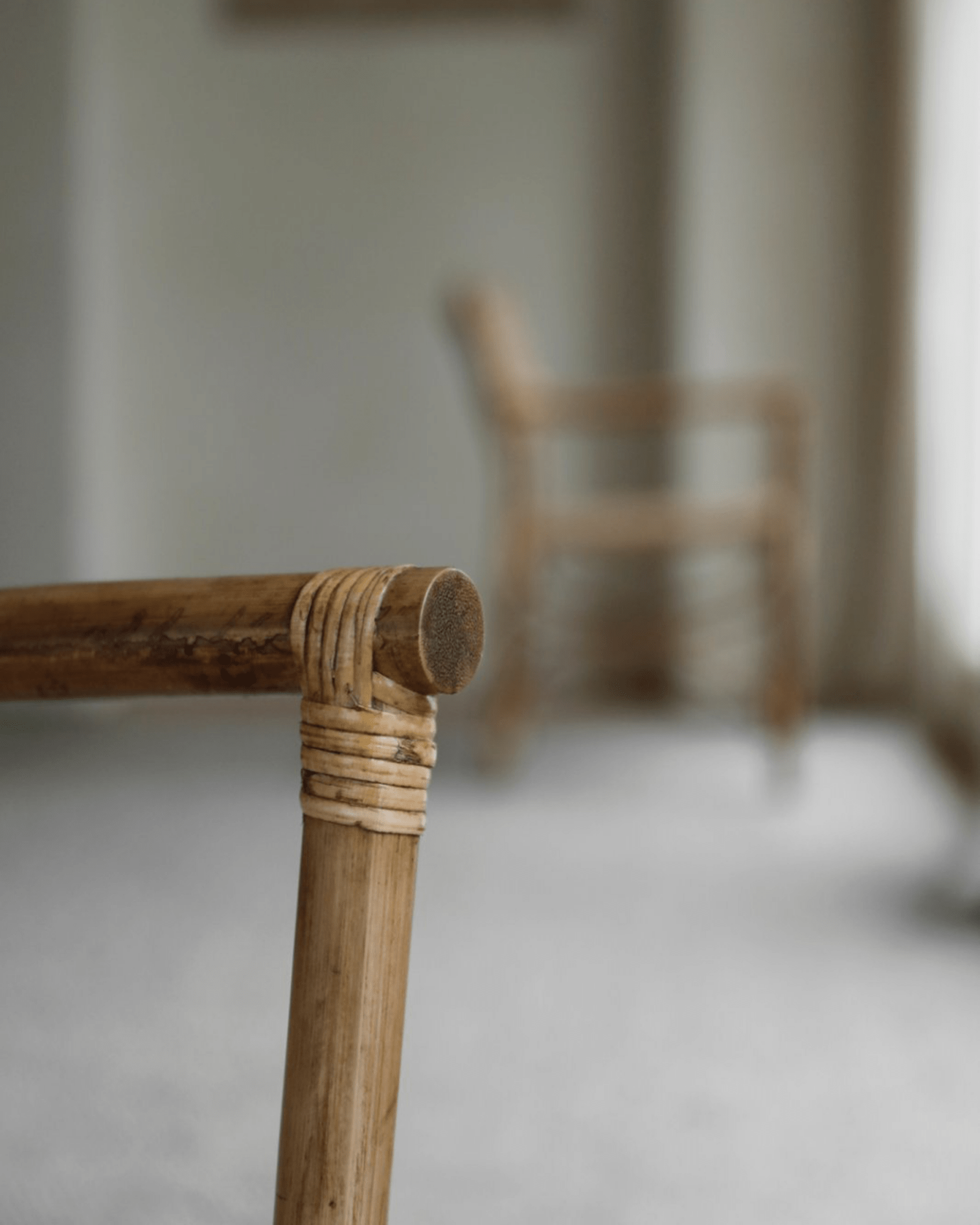 Dingee Chair detail: natural wood frame and woven joint, close up.