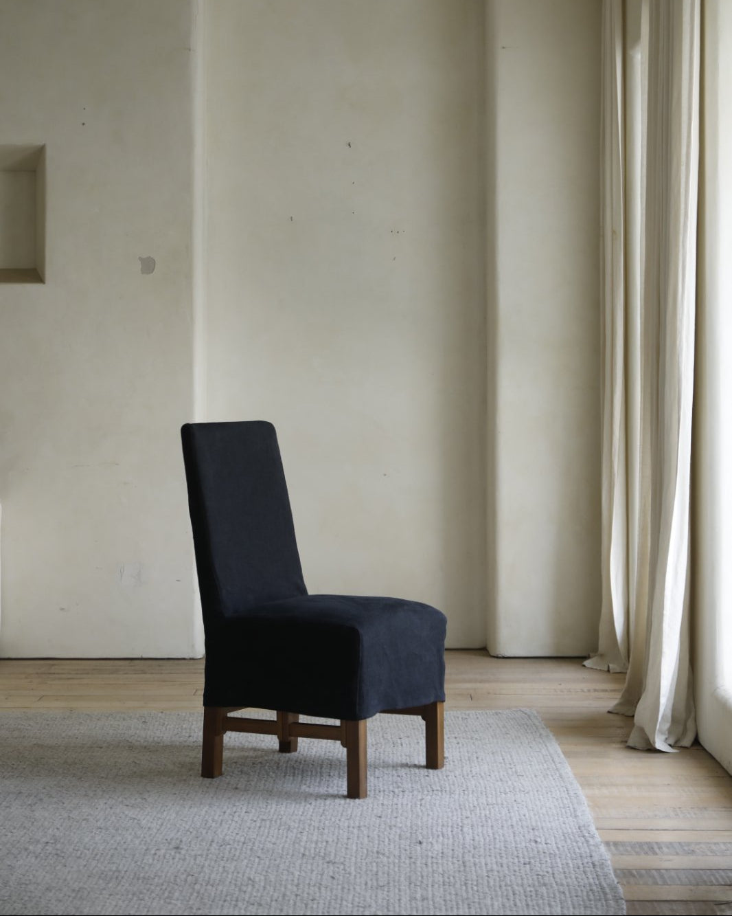 Feast Dining Chair with dark blue linen slipcover, wood frame, modern dining room decor