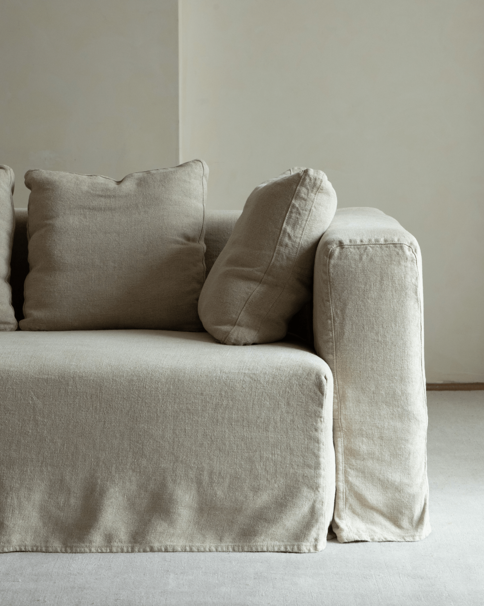 Nola Sofa in natural linen, showcasing soft, breathable Belgian linen fabric and comfortable design