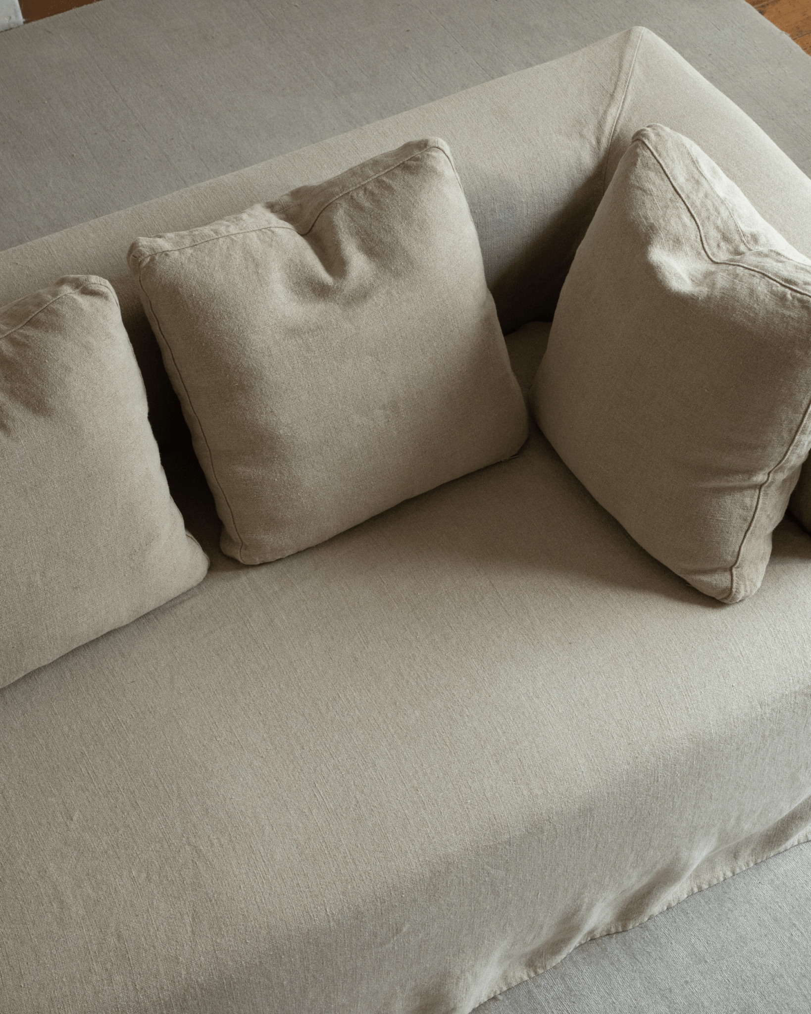 Nola Sofa detail: Natural linen sofa cushions with comfortable, breathable fabric, and modern design.
