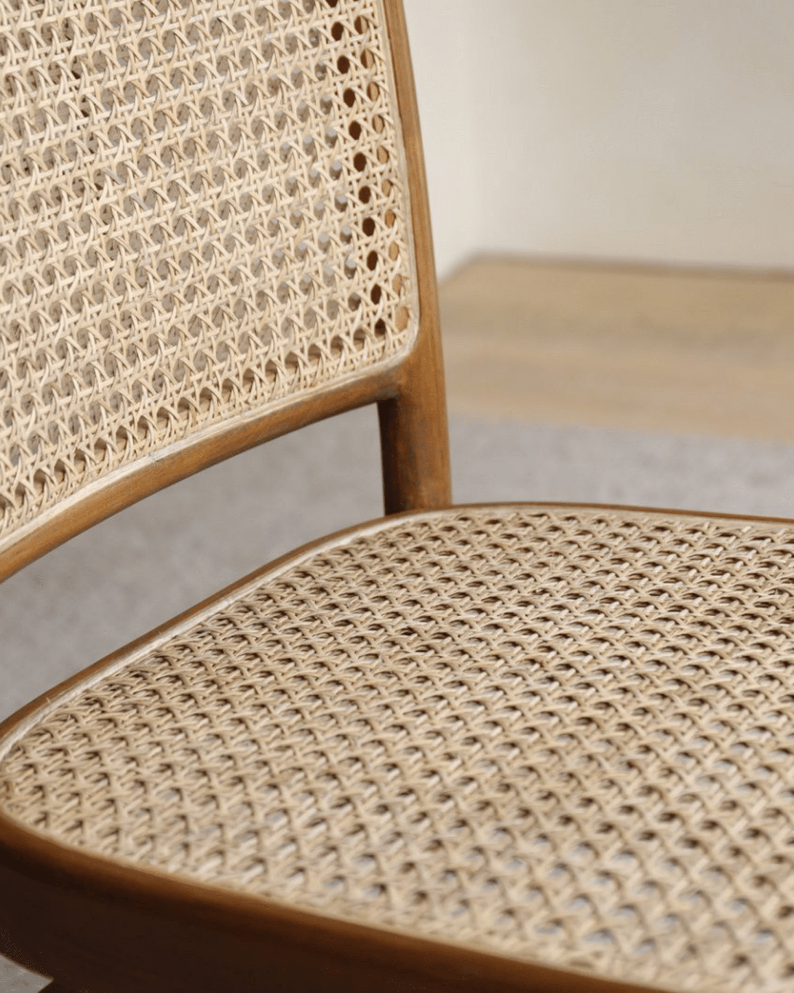 NO.811 Chair detail: Rattan weaving and teak frame, showing craftsmanship and timeless elegance.