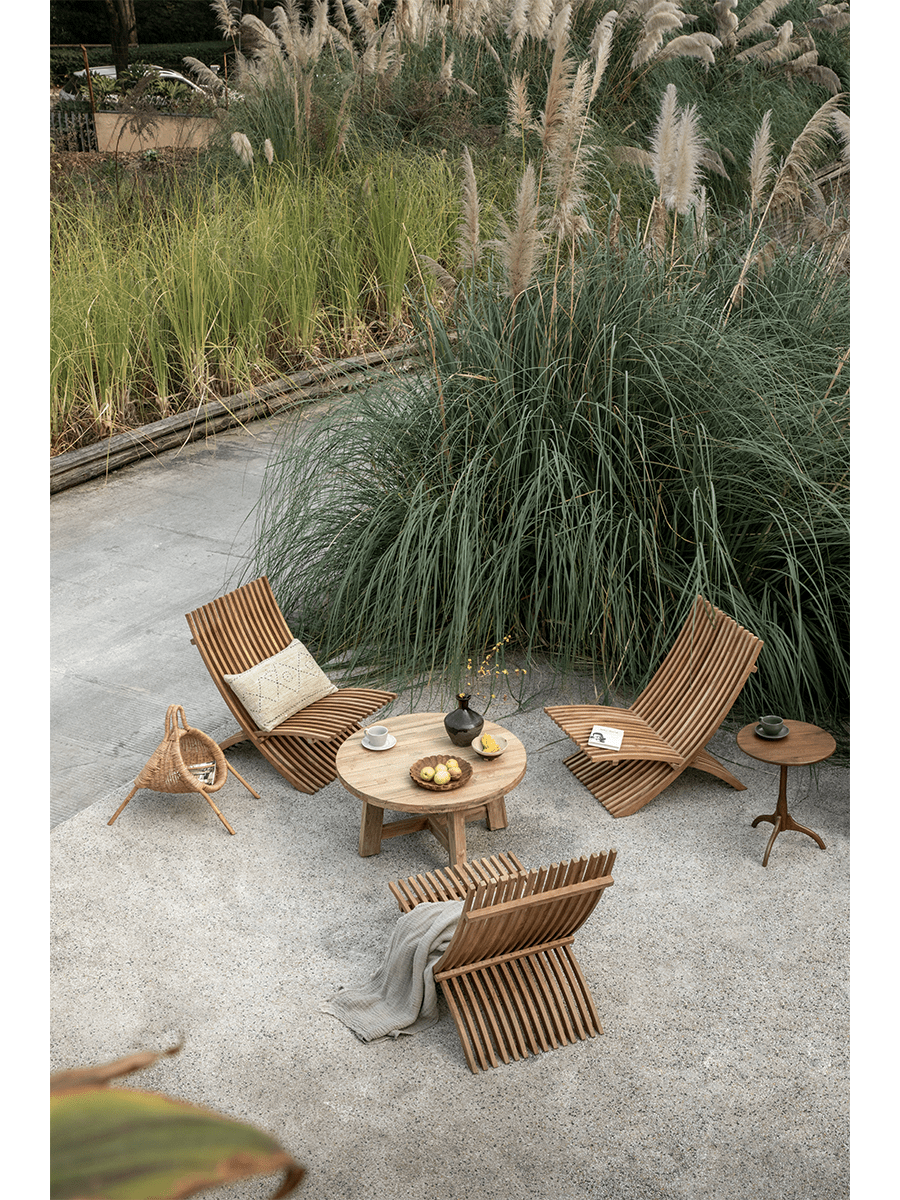 Oly Lounge Chairs in a serene outdoor setting, wooden slatted design, ergonomic and stylish seating