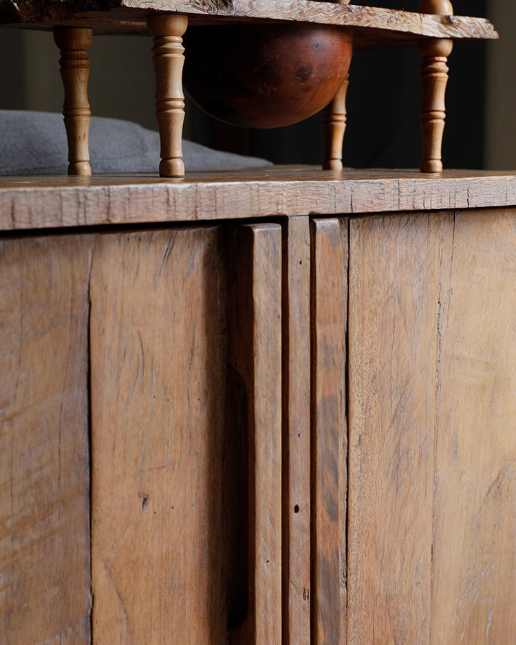 NO.32 Sideboard detail, showing reclaimed wood grain, cabinet doors, rustic design.
