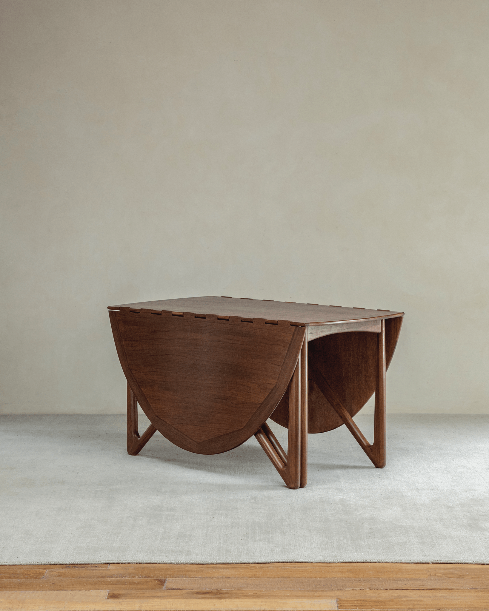 Niels Folding Table in Burmese Teak, extended oval shape, mid-century modern design with V-shaped legs