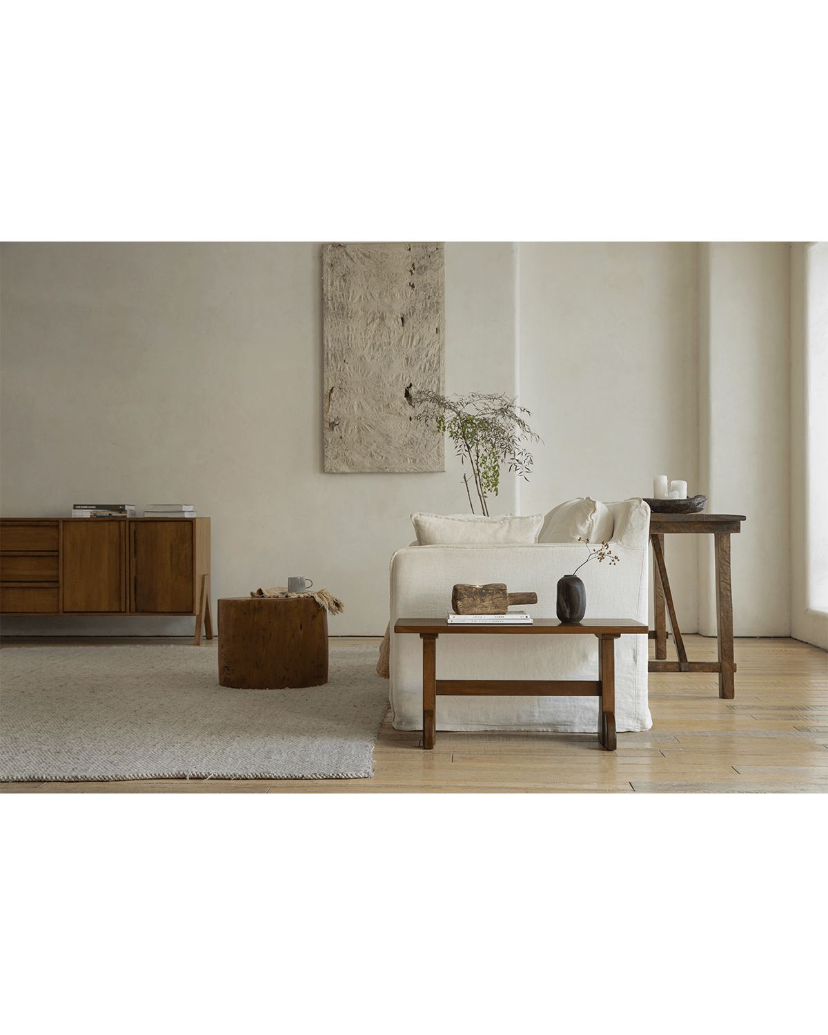 Hoof Side Table in modern living room setting. Features nanmu wood, showcasing design and decor.