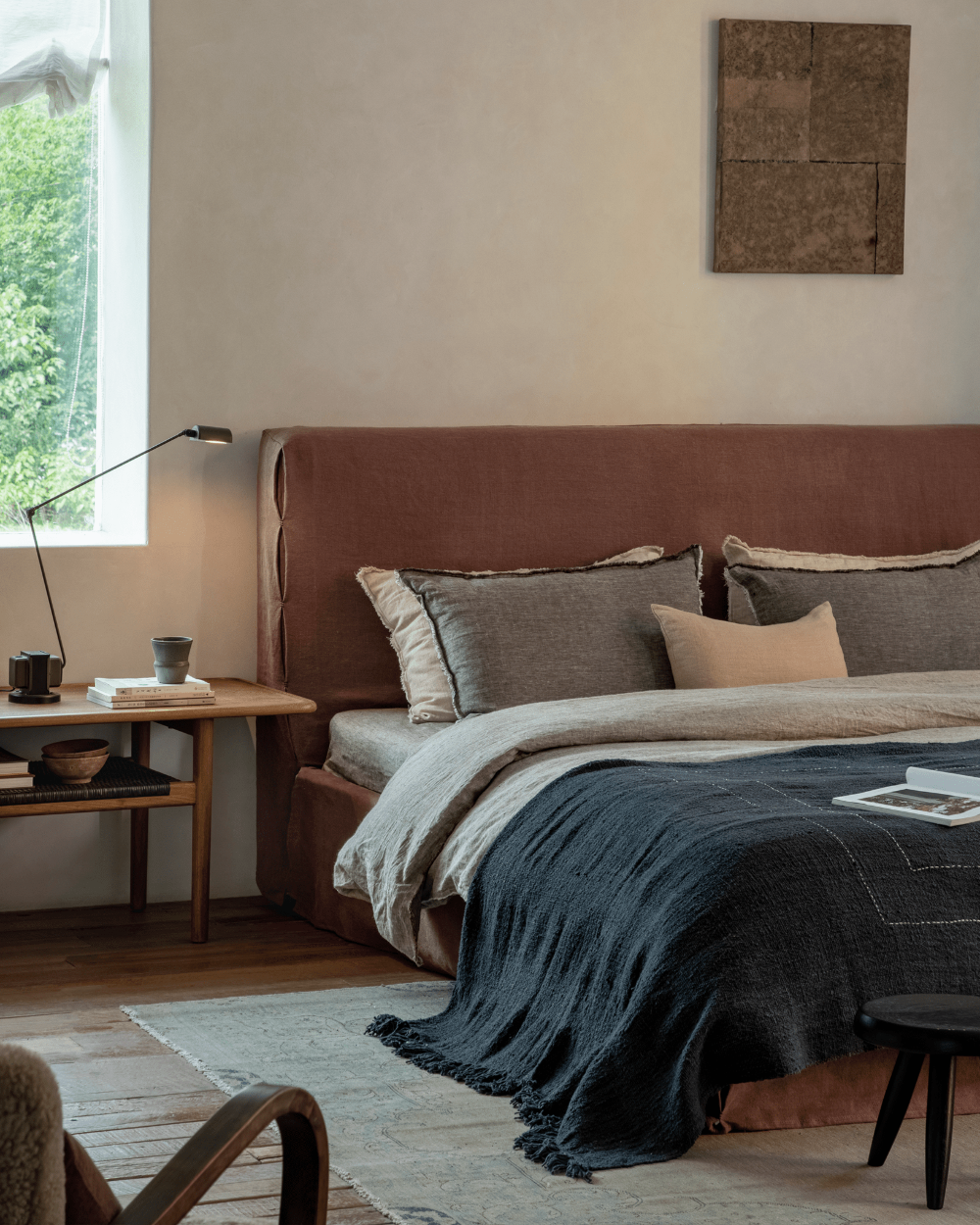 Freya Linen Bed in a serene bedroom setting, terracotta headboard and neutral linen bedding for peaceful sleep
