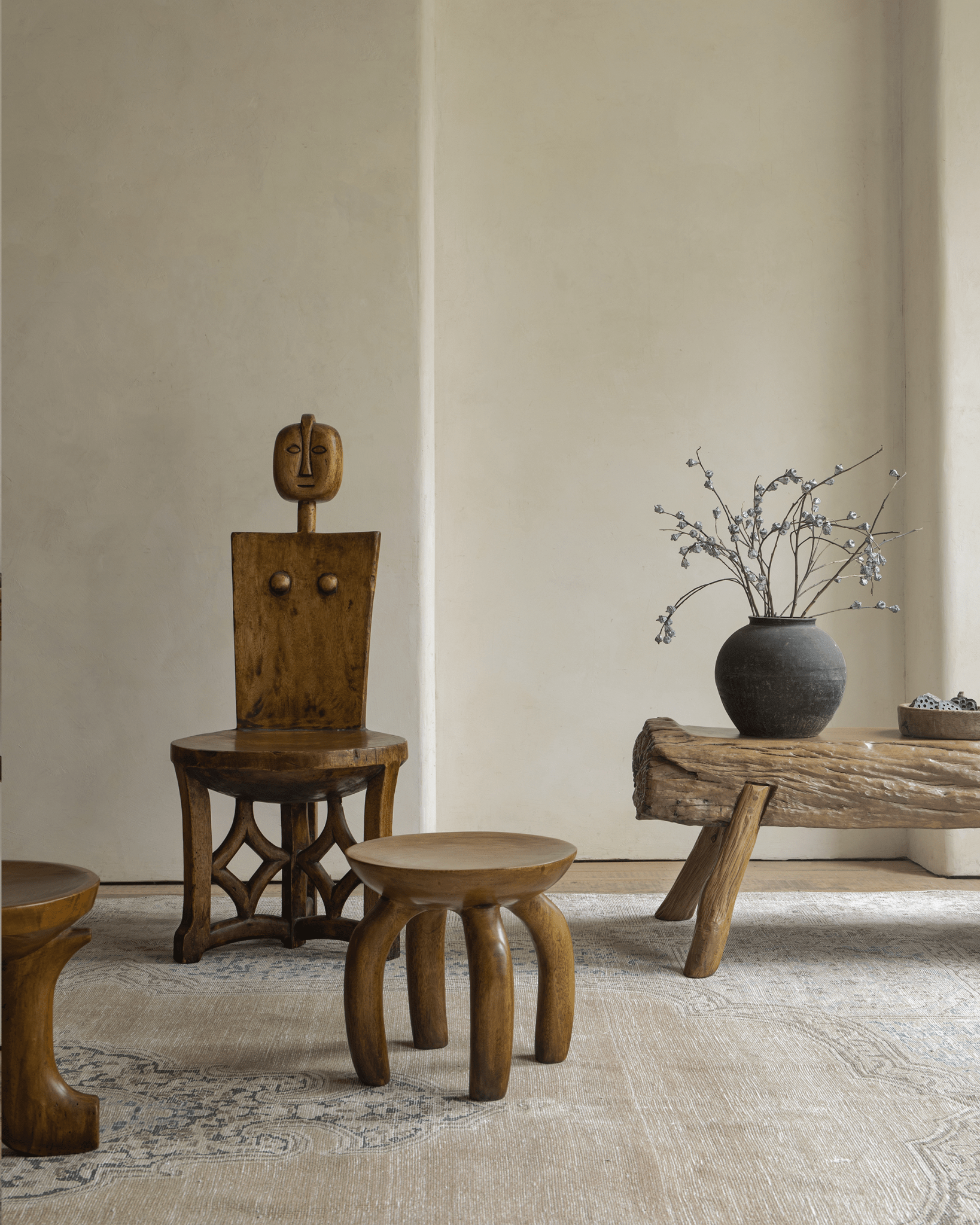 Wooden Jelly Stool and Handcrafted wooden furniture in a room setting. Showcasing elegant design and solid wood furnishings.
