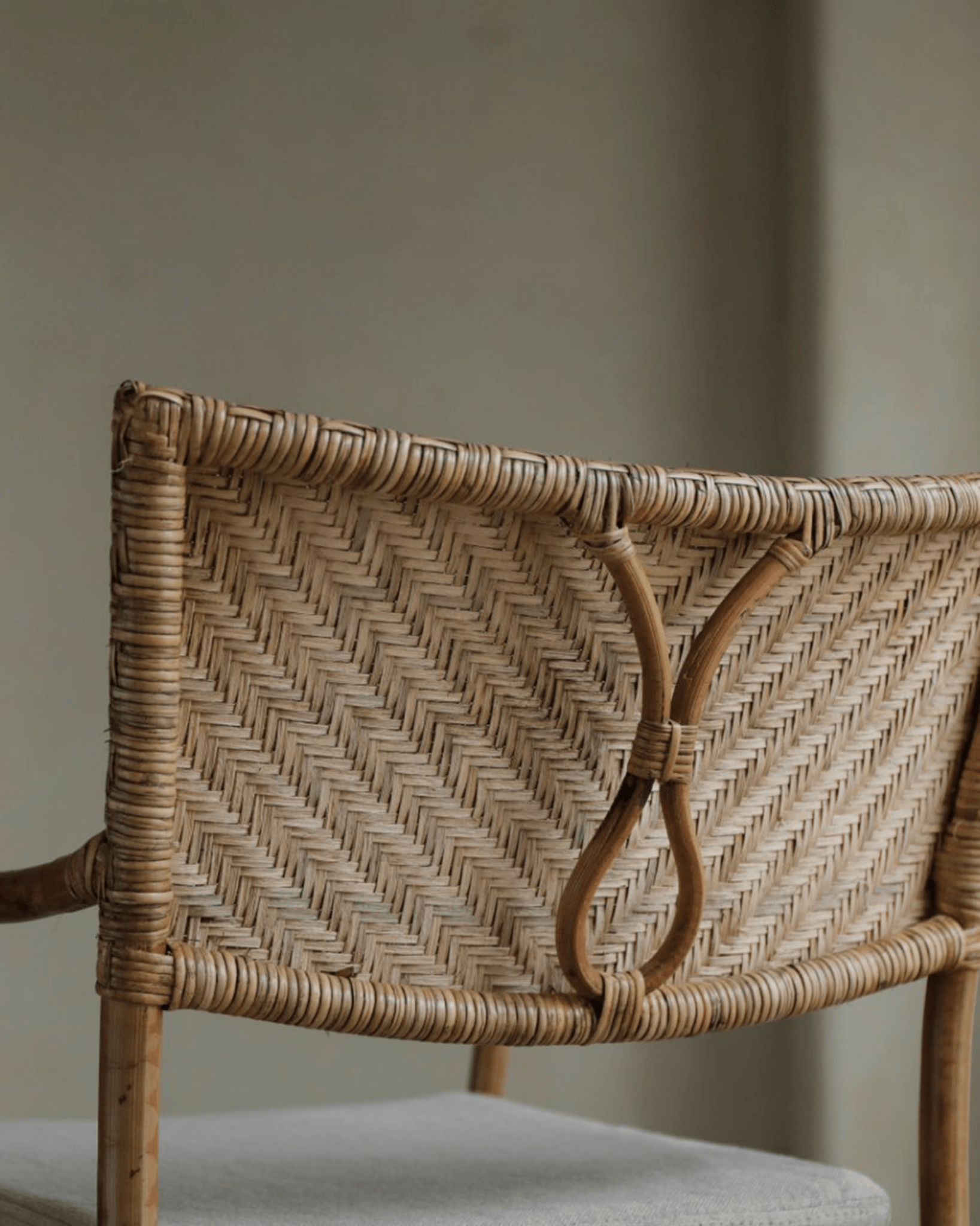 Dingee Chair woven rattan back detail, natural wood frame
