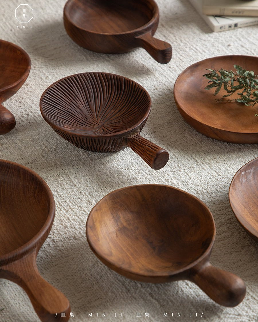 Teak wood Fany Trays by MIN JI, featuring carved leaf and smooth serving designs.