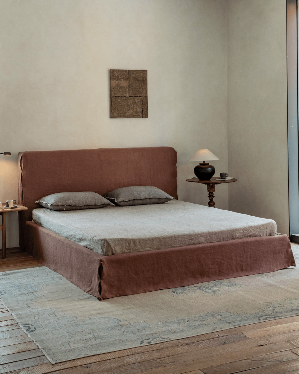 Freya Linen Bed in terracotta linen with natural linen bedding in a modern bedroom