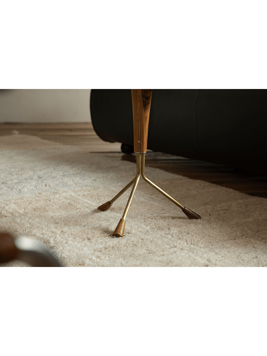 Larsson Side Table detail: Aged Brass tripod base with wooden accents, modern living room design