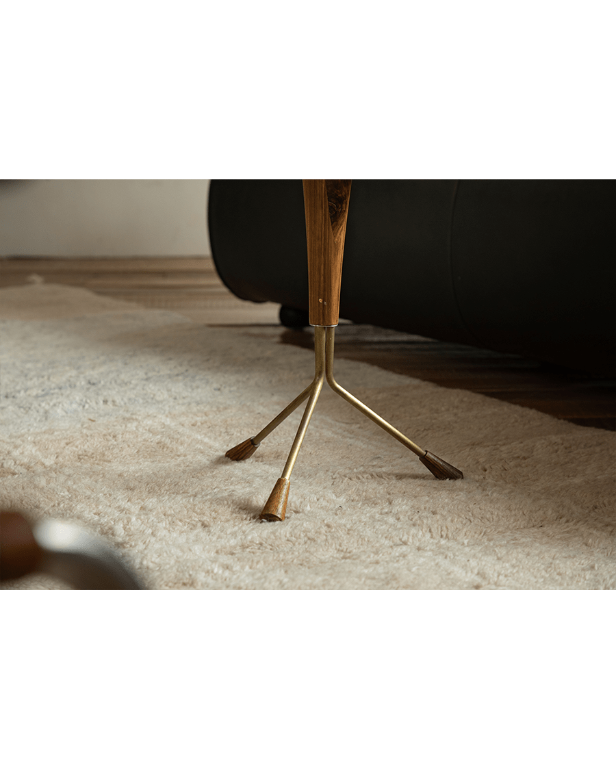 Larsson Side Table detail: Aged Brass tripod base with wooden accents, modern living room design